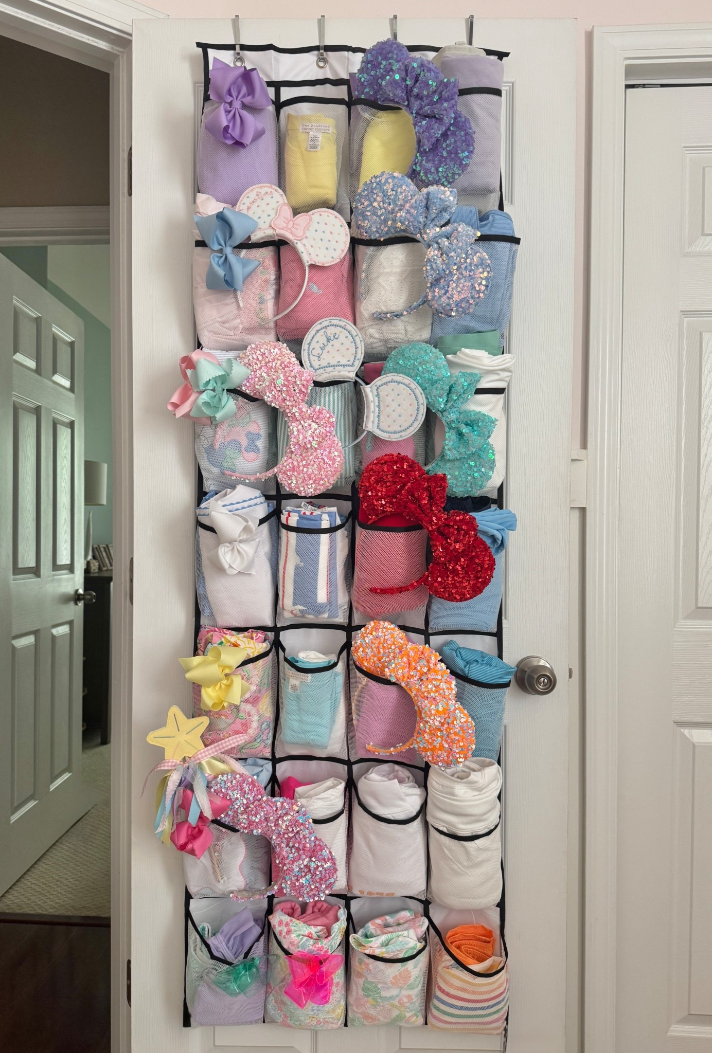 Best travel hack ever! I managed to pack our entire family of four into ONE of these hanging shoe organizers for a 5 day/ 4 night stay at Walt Disney World!! We’ve each got 2-3 coordinating 
outfits per day in here too. Order for your next trip and thank me later! 💁🏼‍♀️
@khrissa williams 

#LTKTravel #LTKgrwm #LTKKids