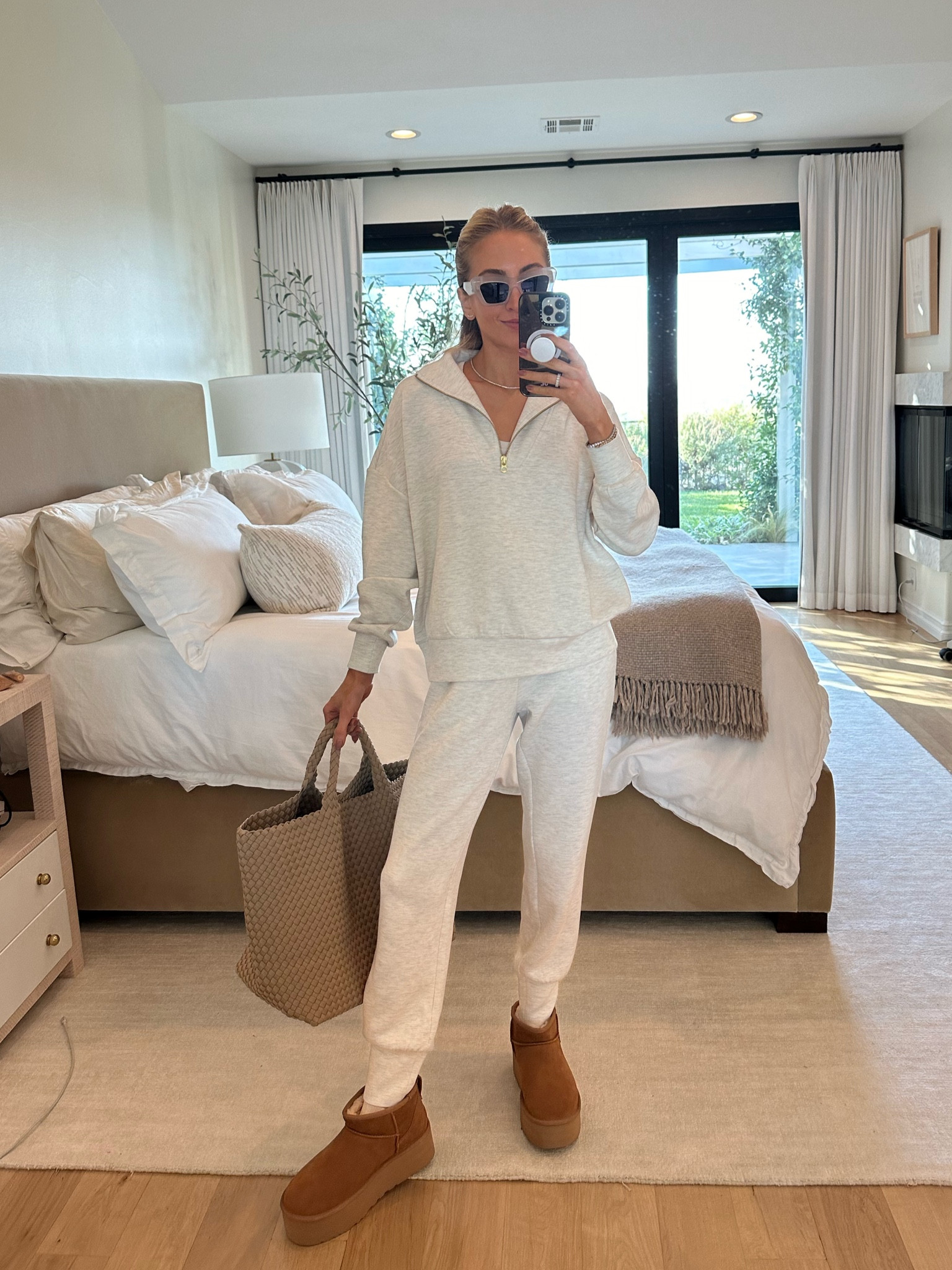 Up early with the time change and doing a coffee and croissant run ☕️🥐 wearing my MVP Varley set in the coziest fabric + my new platform mini Uggs. 

Sizes worn here:
Sweatshirt XS (relaxed fit)
Sweatpants XS (TTS relaxed fit) - they come in two lengths, I’m wearing 27.5 length here - I’m 5’6 height so either length works on me
Shoes 9 (TTS)
Bag is size large

#LTKshoecrush #LTKSeasonal #LTKstyletip