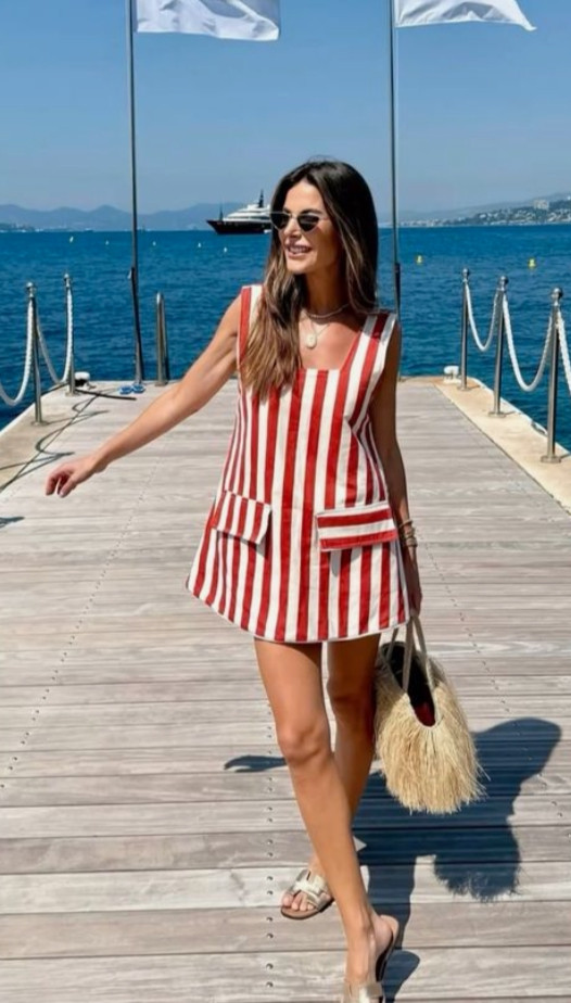 Chic summer outfit with a red and white striped mini dress, woven tote bag, and neutral sandals for a playful, elevated vacation look.
Style tip: choose bold stripes to make a statement while keeping the silhouette simple, and balance the look with neutral accessories like a straw bag and minimal sandals for an effortless, polished summer outfit. 

 

#LTKootd