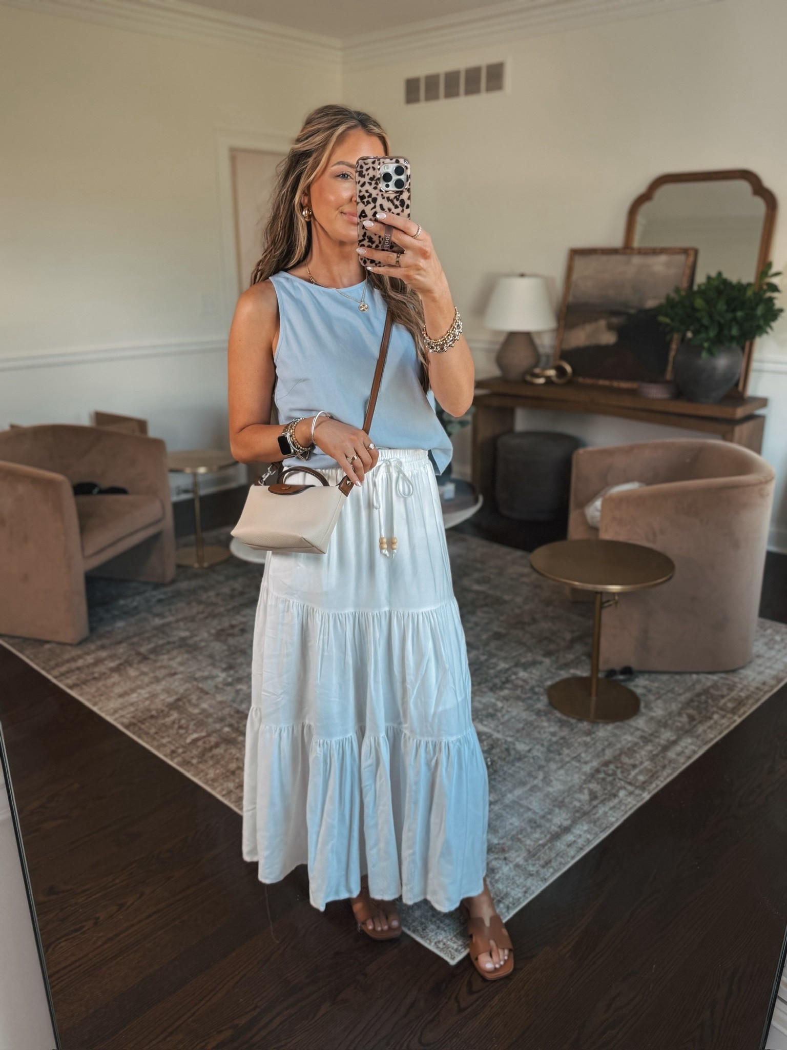 Spring outfit idea. This top is so cute and has the sweetest button details down the back and the skirt has a stretchy waistband making it so comfy. You could wear this to Easter or any spring or summer outing! 

#LTKootd #LTKFestival #LTKTravel