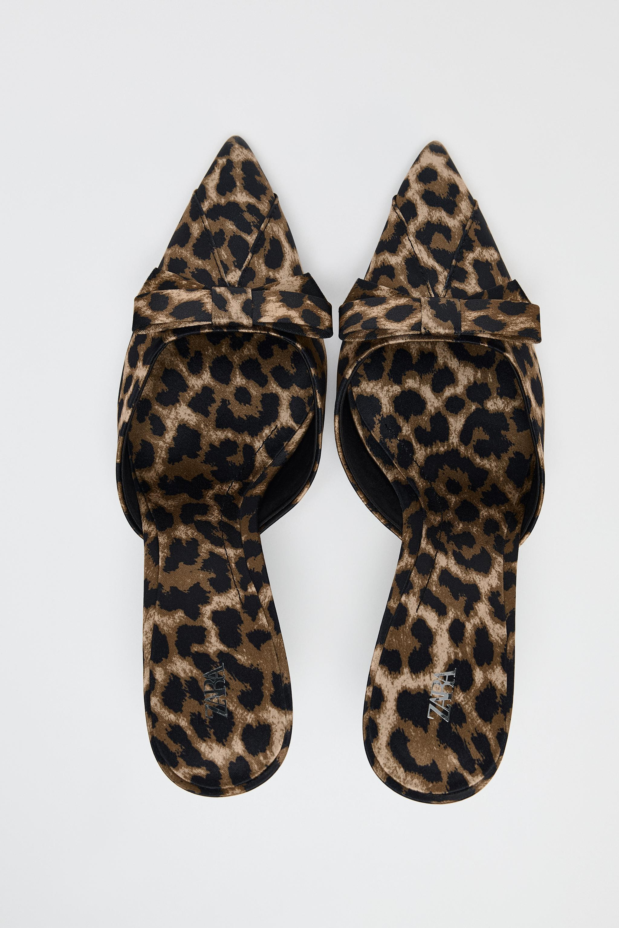 Animal print heeled mules. Bow detail on the front. Thin metallic high heel. Pointed toe. Heel he... | Zara US