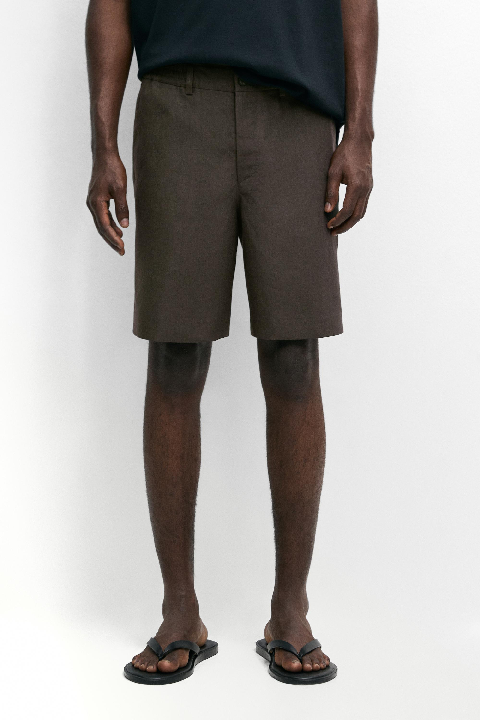 Bermuda shorts made from 100% linen fabric. Designed with a front zip and button closure, an elas... | Massimo Dutti UK