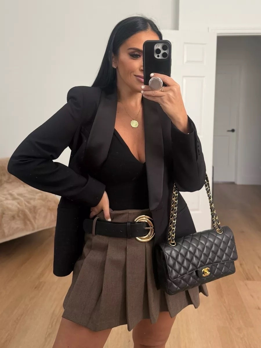 Tailored Tuxedo Blazer wearing size medium. Seamless Halter bodysuit wearing size XS/S Pleated belted skort wearing size large.

