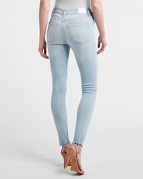 Mid Rise Ripped Raw Hem Skinny Jeans$52.80 marked down from $88.00$88.00 $52.80Price Reflects 40%... | Express