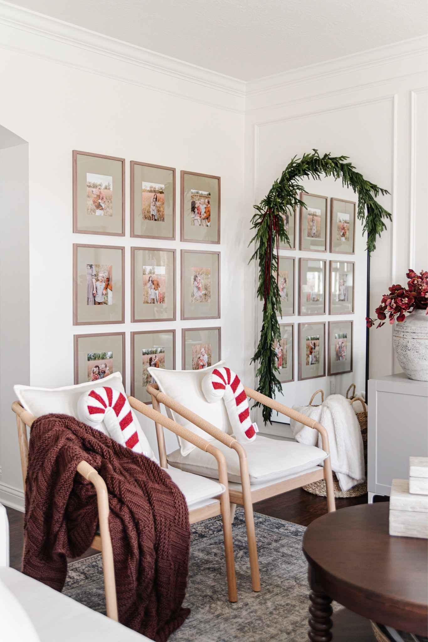 Christmas garland over mirror, arched mirror with garland, norfolk pine garland, christmas living room decor, cozy christmas decor, traditional christmas decor, candy cane pillow, peppermint pillow

#LTKhome #LTKunder100 #LTKHoliday