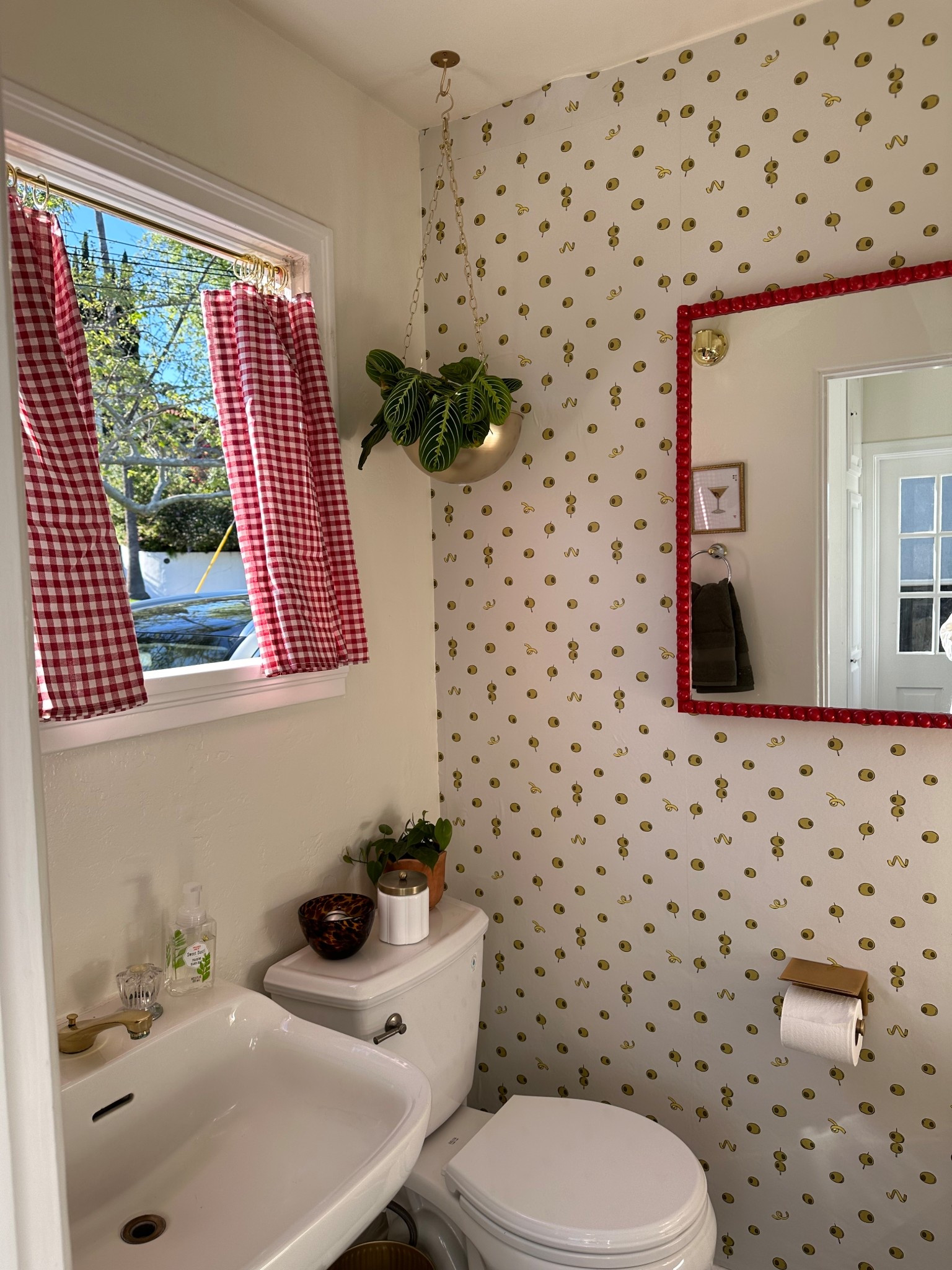 One year anniversary of the martini bathroom makeover 🚽🍸🫒 this olive wallpaper is still chefs kiss in this before and after transformation. 

#LTKHome