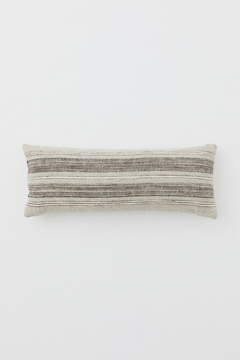 Rectangular cushion with front in a jacquard-weave and wool blend. Smooth, solid-color back. Cott... | H&M (US + CA)