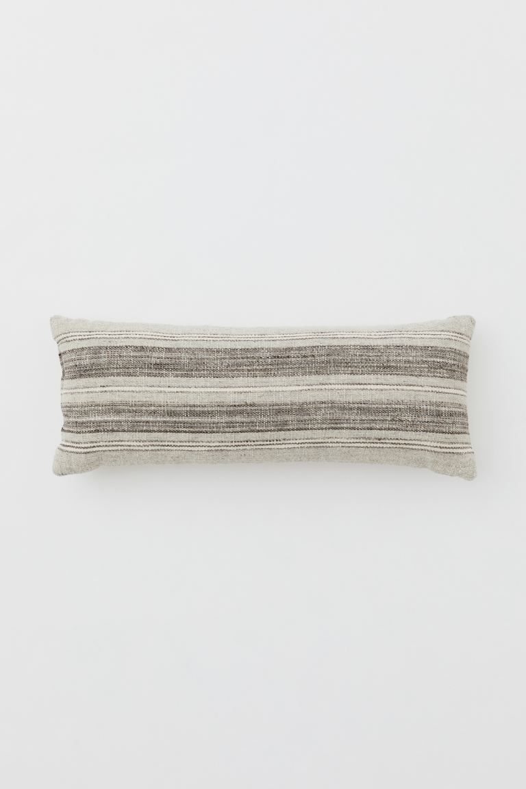 Rectangular cushion with front in a jacquard-weave and wool blend. Smooth, solid-color back. Cott... | H&M (US)