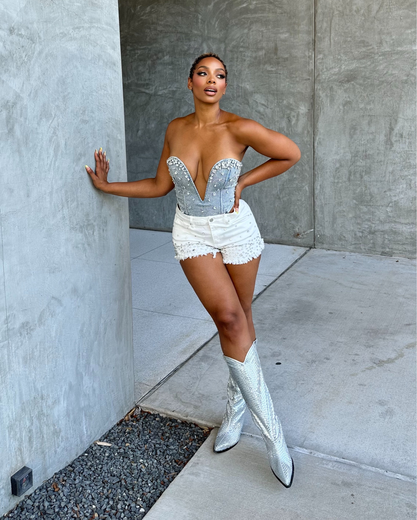 A Texas Gal! 

This is the perrrrfect sexy cowgirl inspired outfit! Here I am wearing an embellished denim corset top with white rhinestone shorts and my rhinestone boots from #shopakira! I love how the rhinestones on each piece is eye catching. 🔥😎