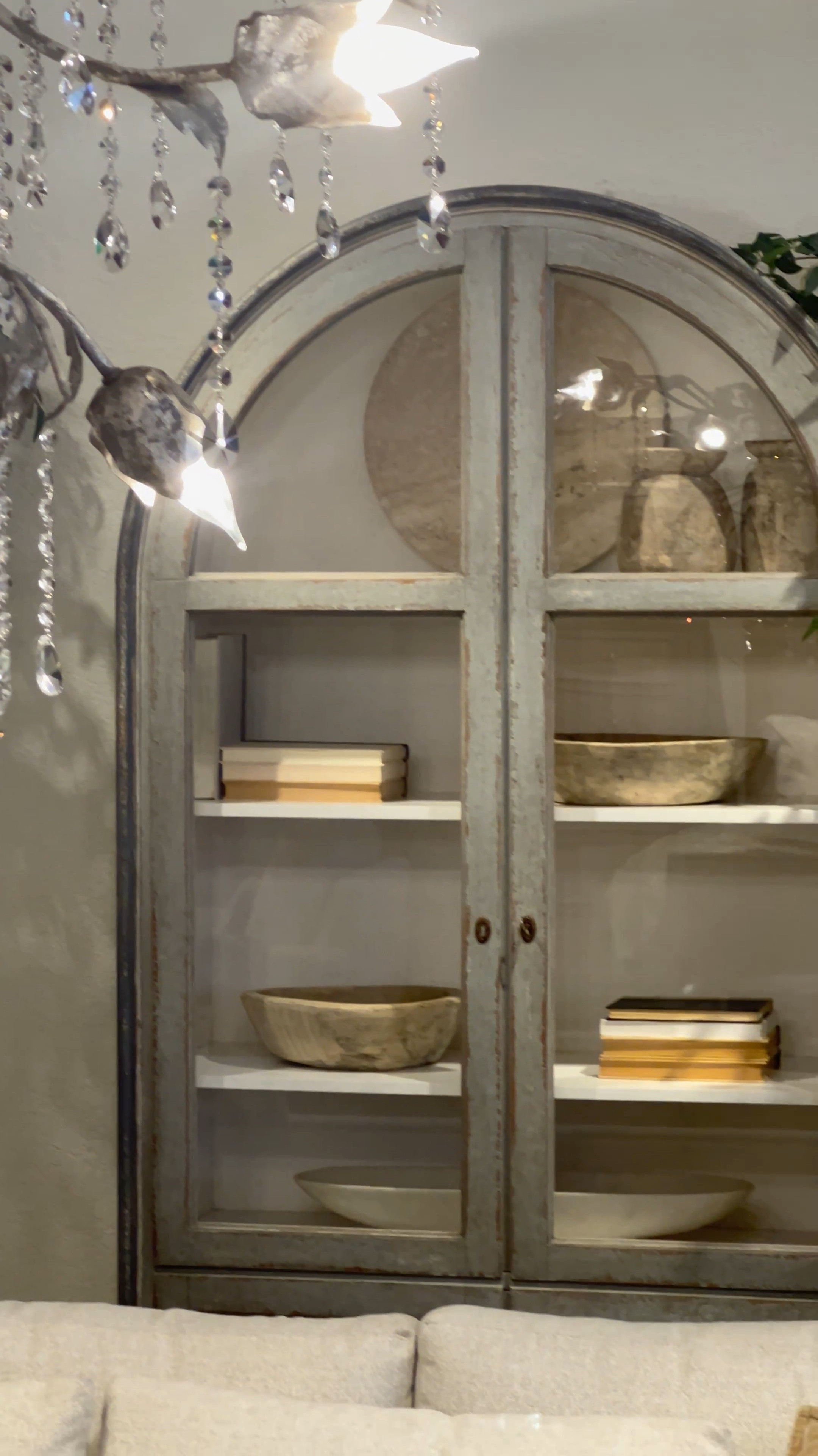 Arhaus Arched Cabinet, Chandeliers, Neutral Living Room Decor, Luxury Home 

#LTKFind #LTKstyletip #LTKhome