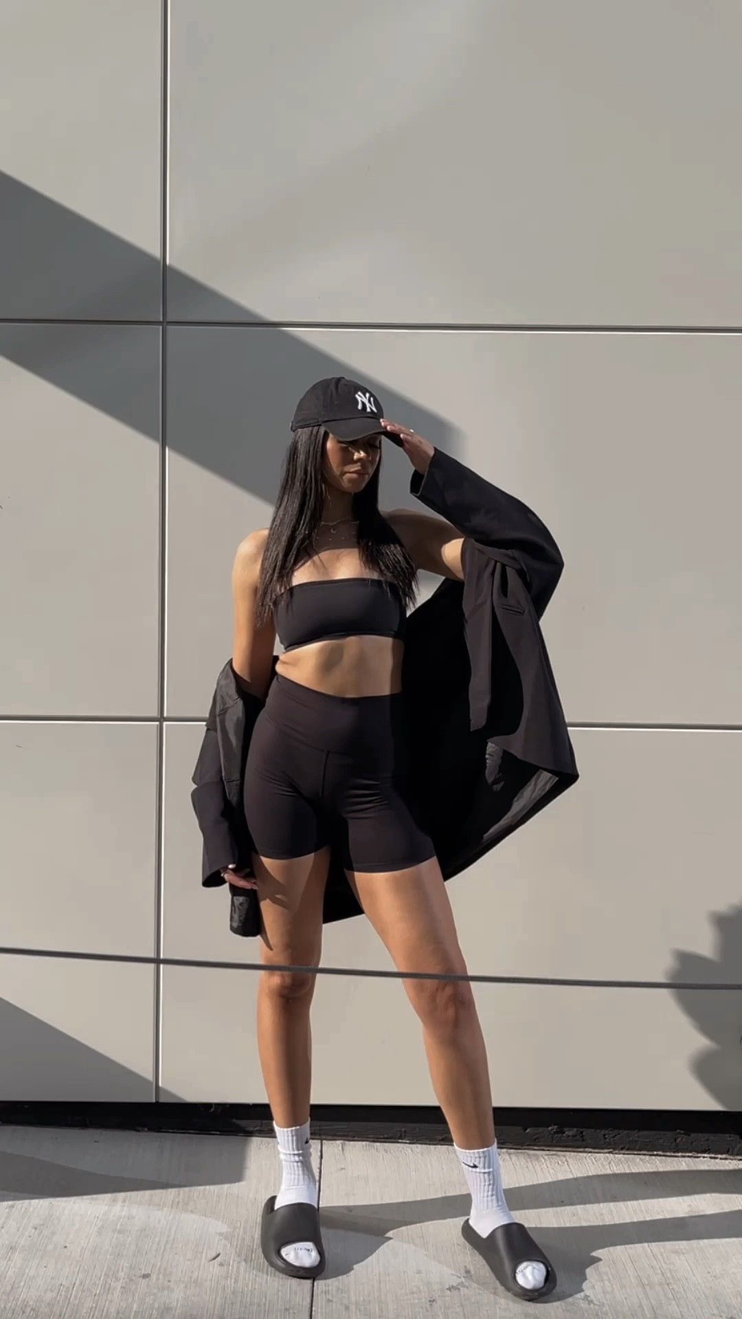 Streetwear fashion, street style, street wear, casual outfits, casual streetwear, bike shorts, biker shorts, bandeau top, Yankees hat, black hat