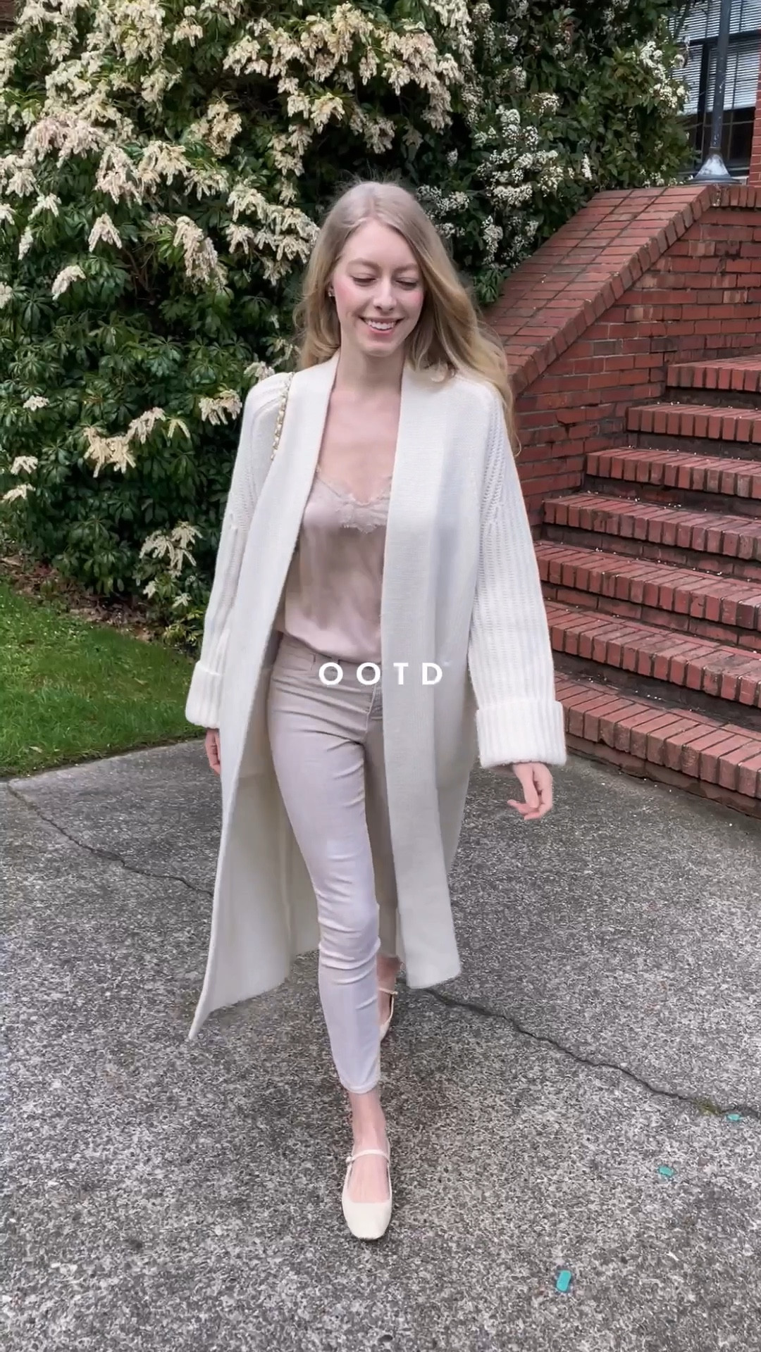 Spring look with longline cardigan, blush pink silk cami and beige jeans neutral flats. Chanel Diana bag in white. 
