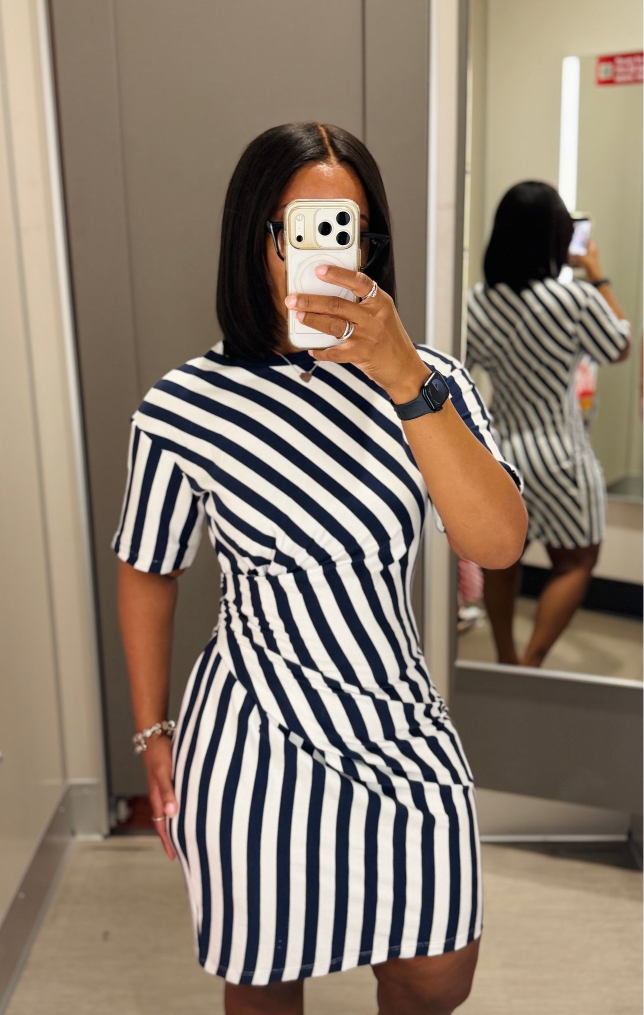 Wearing a size small in this wrap mini dress. 

It looks black on camera but this is navy blue and white! 

Love the fit, it’s going to hug your curve and the wrap part will camouflage your tummy area. Stretchy and super comfortable.

#LTKPetite