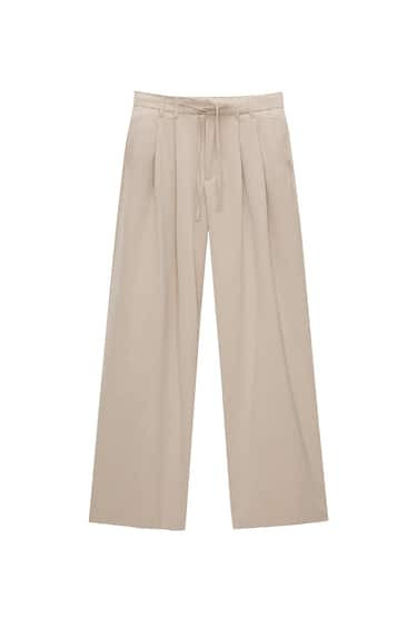 PANTALON FLUIDE À PINCES RAYURES TENNIS | PULL and BEAR FR