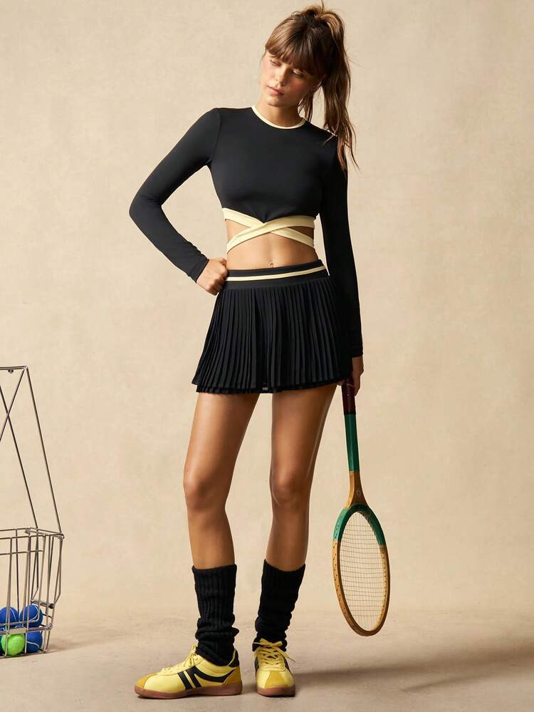VARSITIE Women's Black And Yellow Crossover Hem, Cutout Back, Short-Sleeved Top And Contrasting High-Waisted Pleated Skirt With Built-In Jumpsuit Shorts Tennis Outfit. | SHEIN