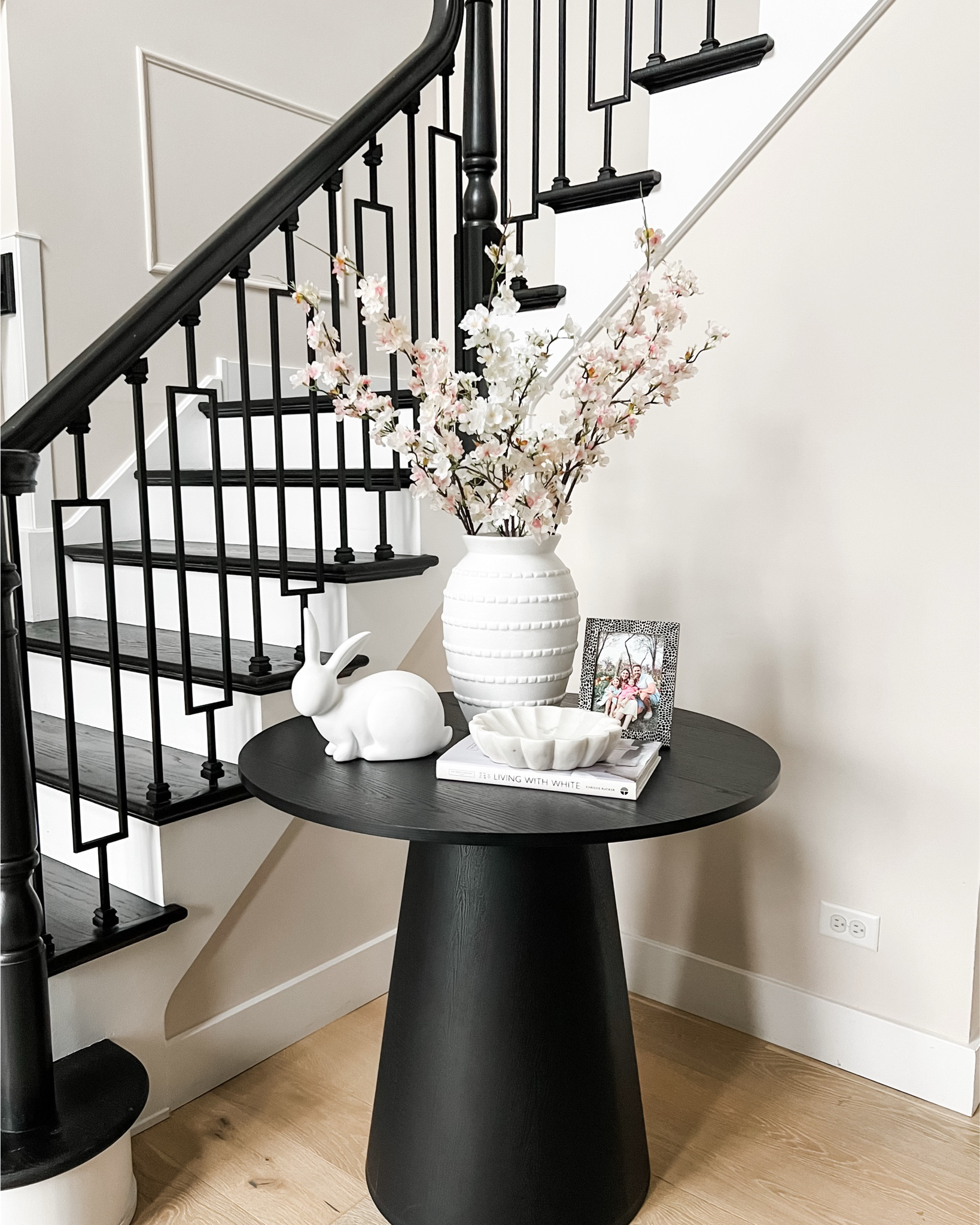 Spring refresh in the entryway 🌸
Simple layers, fresh florals, and all the light + airy vibes. 

#LTKOver40 #LTKSeasonal #LTKHome