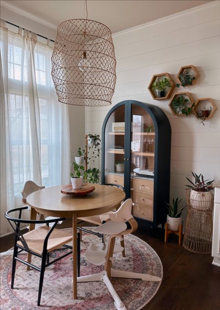 Tiny dining room nook makeover. Anthropologie Armoire. Round kitchen table is perfect for our fam of 4, comes with a leaf. Chairs wipe easily. Plants are all real 😍

#LTKFind #LTKhome #LTKsalealert