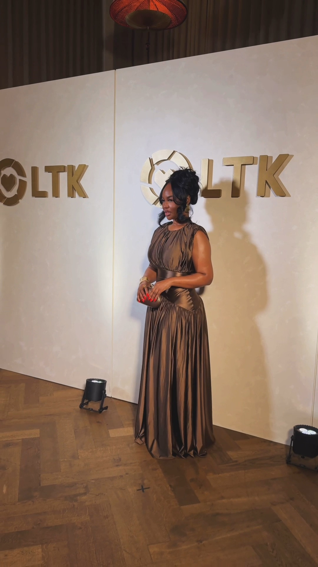 Wore this chocolate brown dress to the LTK Awards during NYFW and it was SUCH a moment. 🤎✨ The draping, sheer details + high slit make it perfect for a birthday, date night, wedding guest look, gala or any special occasion.

I’m 5’3” wearing a size Small—they recommend sizing down, and I agree. It is pretty long on me, but completely doable with heels. I paired it with these gunmetal/gold strappy heels in my true size 7.5 for the perfect finishing touch.

#LTKootd #LTKgrwm #LTKvlog