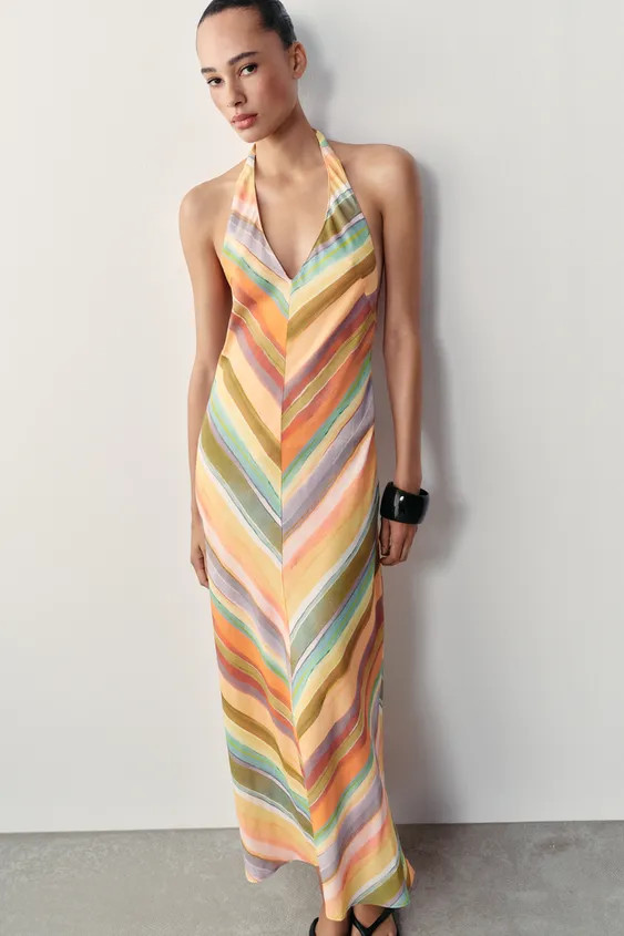 Halter neck dress with V-neckline and open back. Side hidden in-seam zip closure and back tie fas... | Zara US