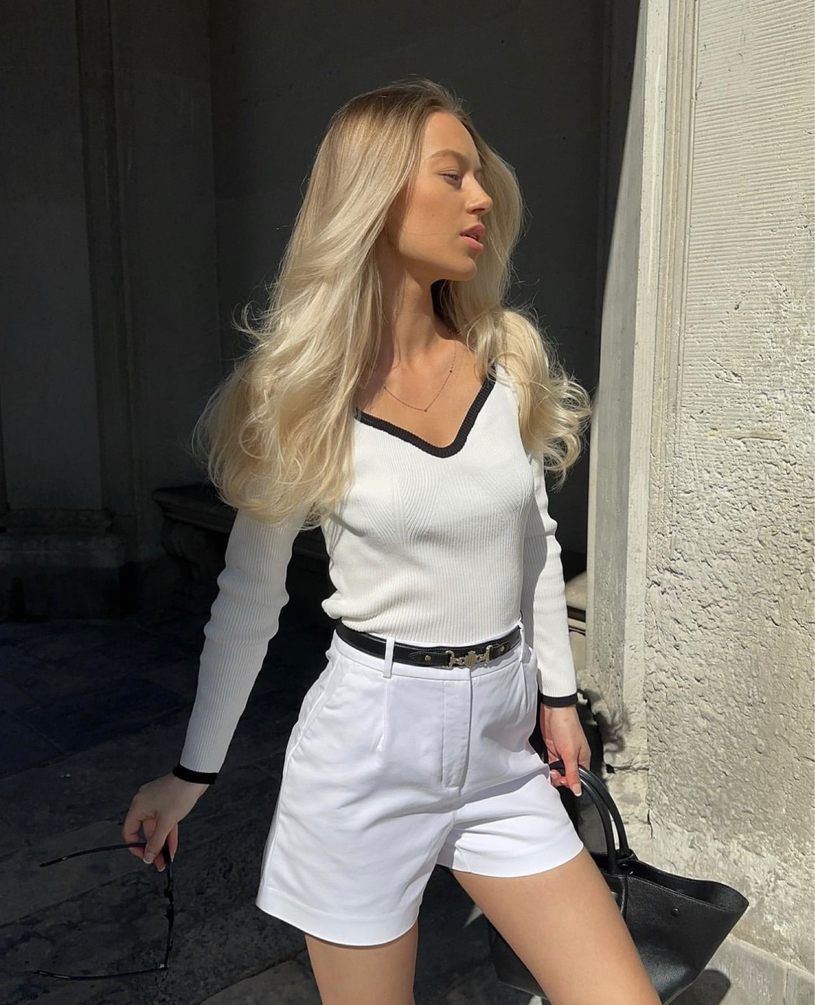 Old money style, meredith blake style, classy summer look, all White outfit, White shorts, leather belt, demellier bag, black and White top, casual look, White elegant outfit