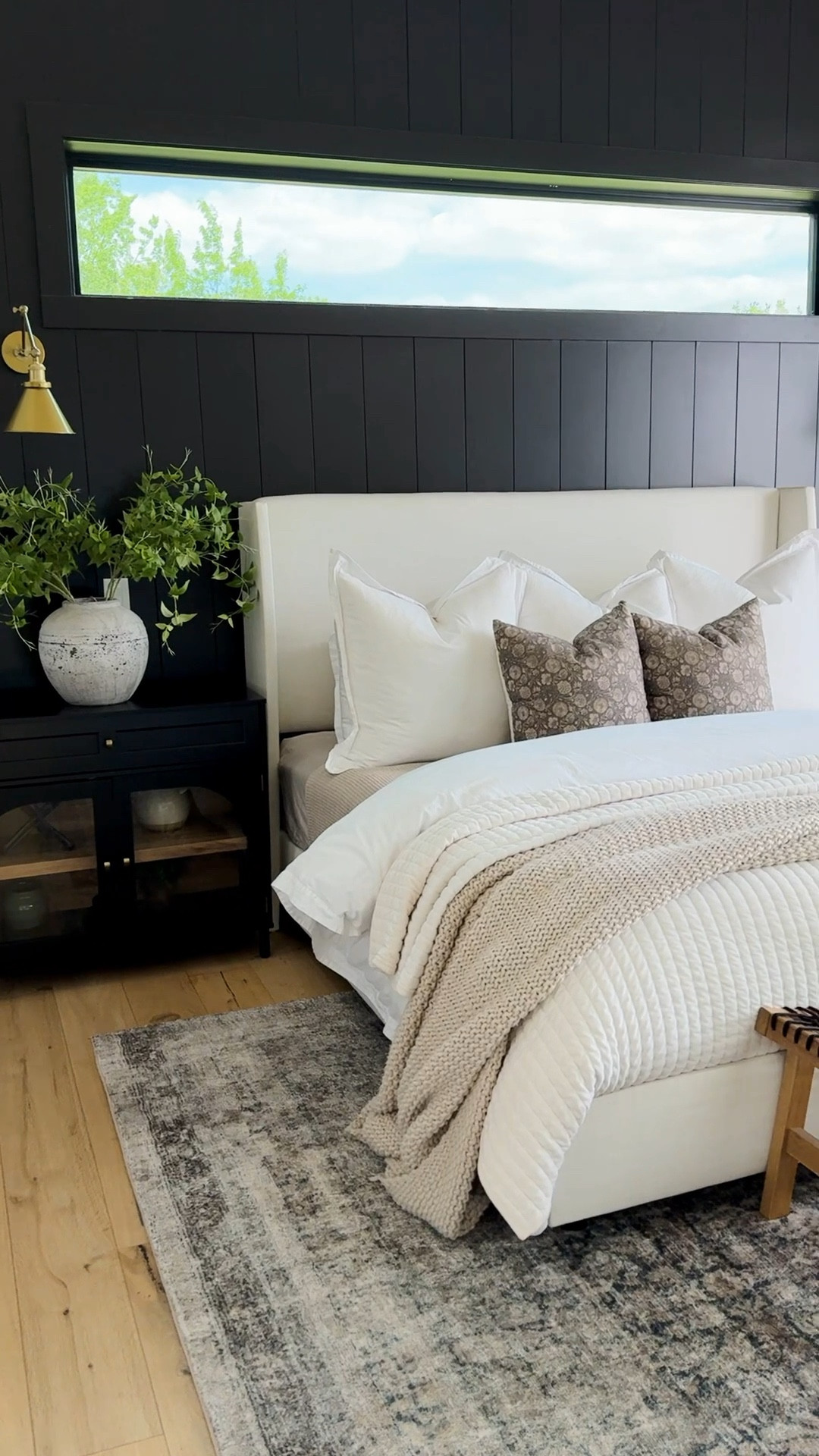My bedroom is my sanctuary—a place where comfort and design come together seamlessly. I love the drama of the black shiplap wall paired with the soft, inviting textures of my bedding. The upholstered bed adds a cozy, modern touch, while the warm brass sconces bring just the right amount of elegance and functionality. Adding greenery and natural wood accents keeps the space feeling fresh and grounded. Every detail, from the layered textiles to the soft rug underfoot, was chosen to create a retreat that feels peaceful yet sophisticated—exactly how I want to end my day.


#LTKFindsUnder100 #LTKHome #LTKSaleAlert
