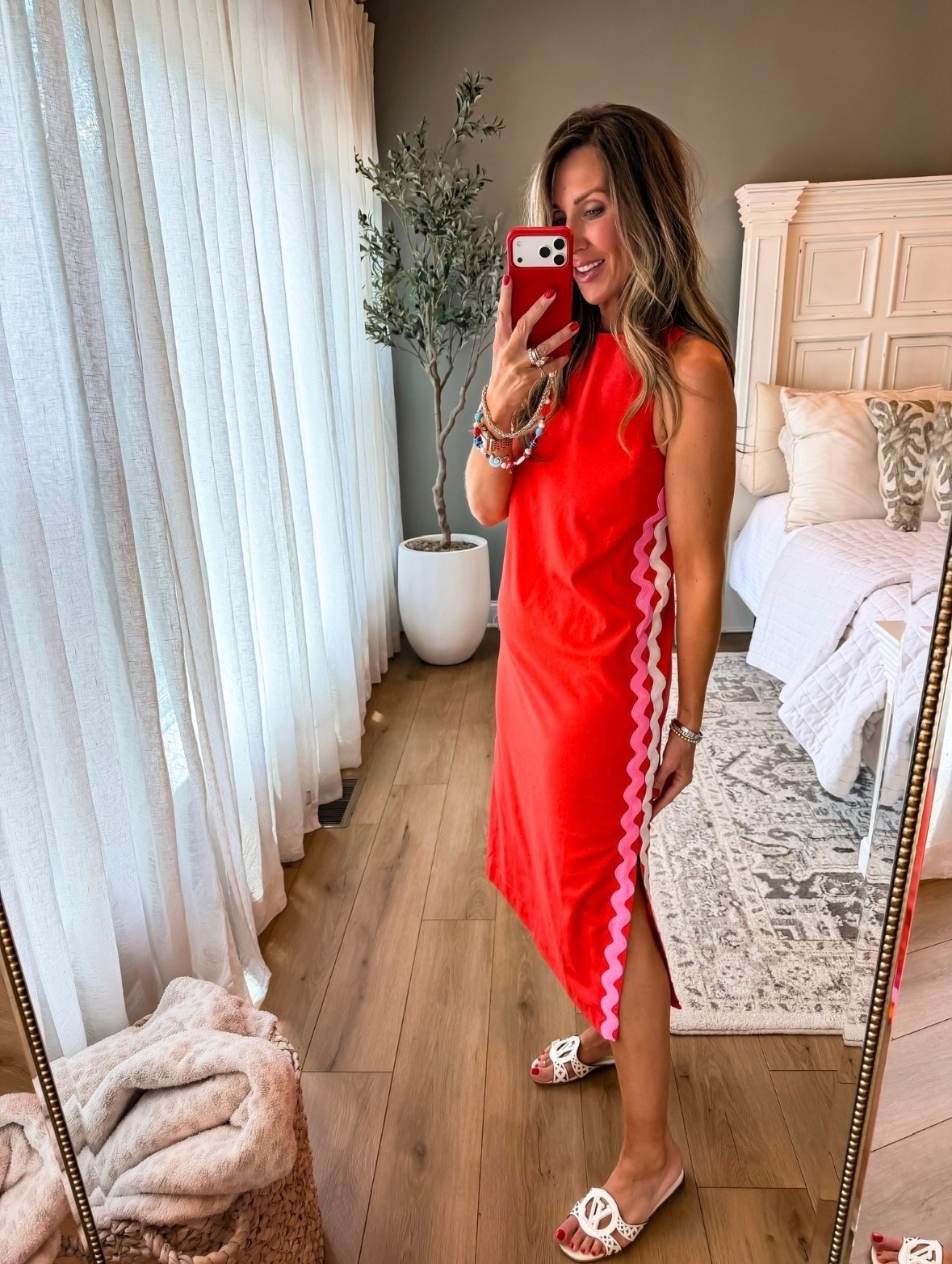 This red midi dress is such a fun statement piece for summer. The contrast ric rac trim adds the cutest pop of detail, and the relaxed fit makes it easy to dress up or down. Just add sandals and you’re ready for vacation, brunch, summer parties, or a night out.

Red midi dress, Ric rac trim dress, Summer dress, Vacation outfit, Resort wear, Colorful fashion, Statement dress, Brunch outfit, Beach vacation style, Casual chic outfit, Summer party dress, Vacation fashion, TheMomInStyle

#LTKootd #LTKSeasonal #LTKOver40