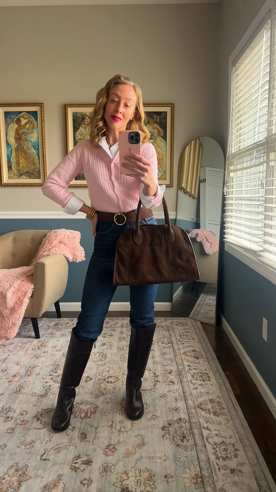 Pink cable knit cardigan layered over a white button-down, dark denim, brown leather belt, tall leather boots, and structured brown satchel.

Classic spring outfit idea for work, lunch, or everyday wear.

Timeless American style.




#LTKootd #LTKgrwm #LTKOver40