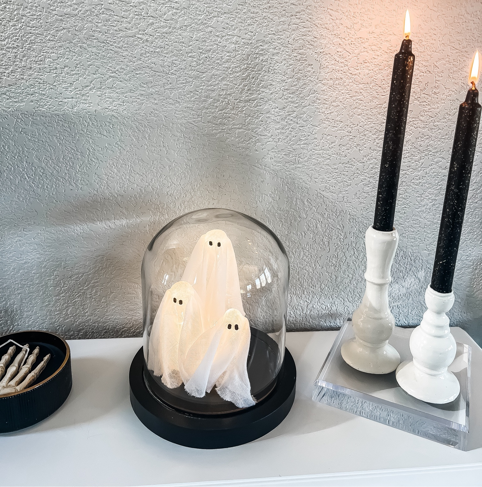 Halloween decor on my entry way table. I love this light up ghost cloche! You can set a timer for when you’d like it to light up. I found this Skelton candle at Homegoods, but found a poshmark listing for the exact 1!

#LTKHome #LTKHalloween