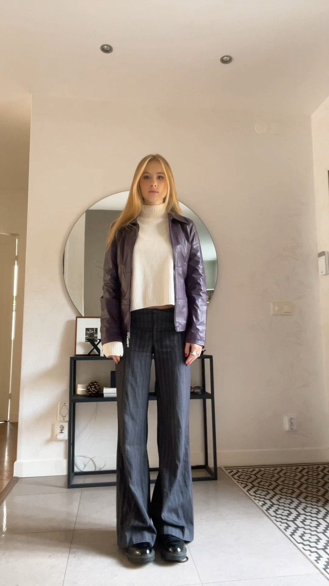 White vest, high neck knitted cream sweater, red leather jacket, leather bomber jacket, pinstriped trousers, black boots, silver buckle, autumn outfit ideas 

#LTKstyletip #LTKSeasonal #LTKeurope