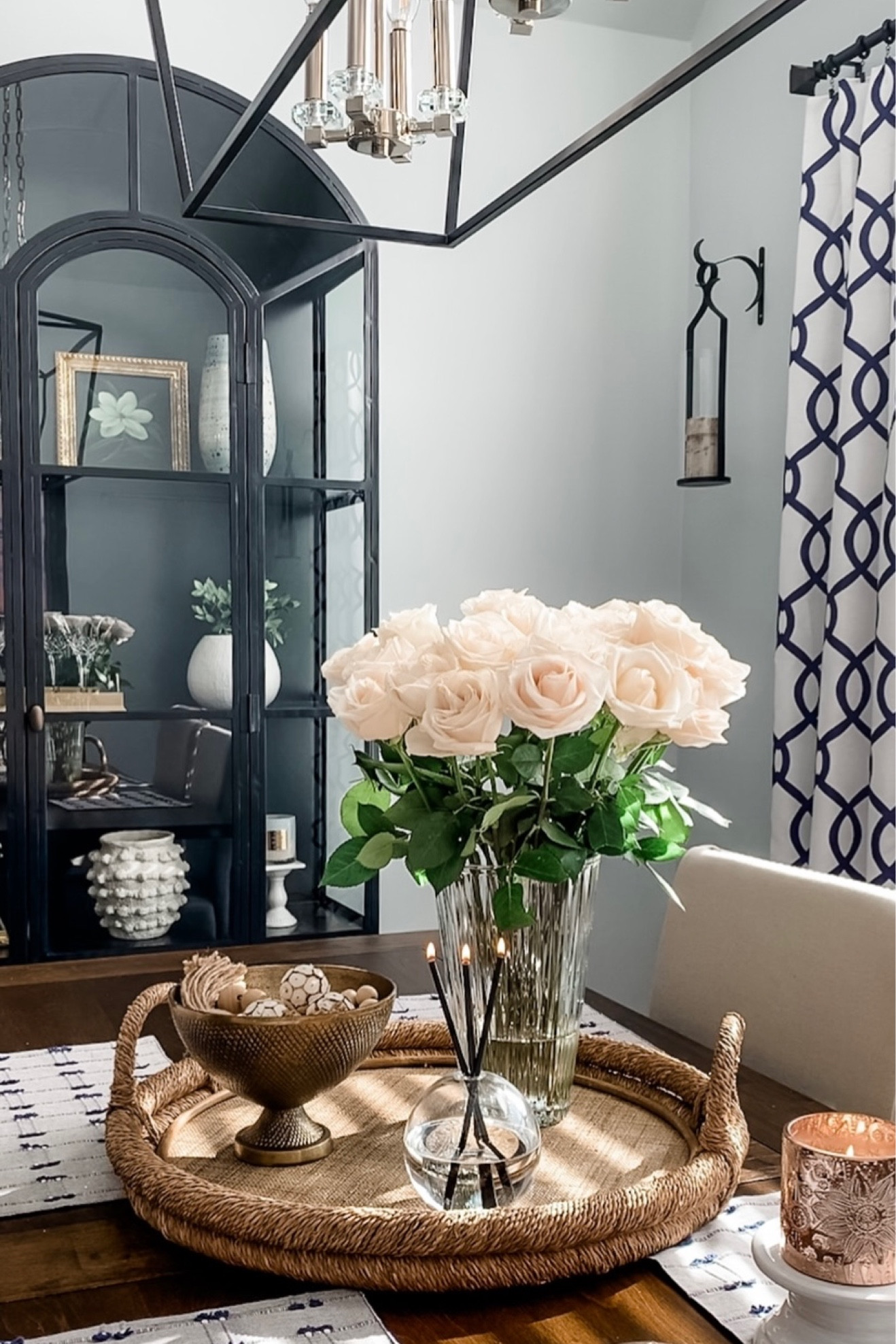 Spring transition with beautiful white roses, black display cabinet, Glass vase, Seagrass tray, brass bowl, Minka vase, artwork, white round vase, glassware, . Sconce set. Home decor accessories, interior styling. Target, Amazon, , Afloral, Michaels, Macy’s home. 

#LTKunder50 #LTKhome #LTKsalealert