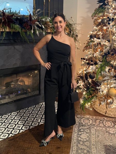 Add some holiday sparkle to your Christmas party outfits with rhinestone kitten heel pumps, rhinestone earrings and a festive clutch. A black jumpsuit is classic and comfortable to dress up for any occasion like Christmas or NYE

#LTKHoliday #LTKSeasonal #LTKparties