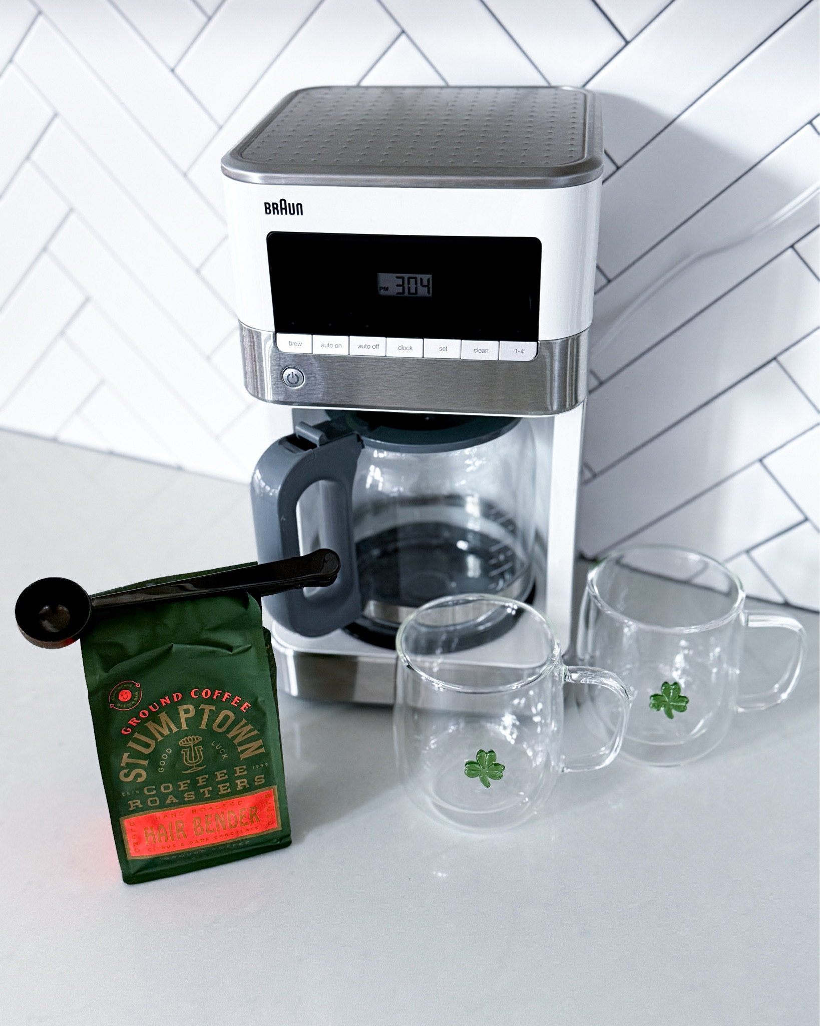 We’ve had this Braun BrewSense 12-Cup Drip Coffee Maker for years & it has never once let us down. As a stay at home mom, keeping my cup filled & hot all day is non negotiable & this thing delivers every single time. No fuss, no fancy settings to figure out, just a really solid pot of coffee that stays hot & ready whenever I need it. It’s one of those appliances that just works & that’s honestly everything. & I’m a little obsessed with these St. Patrick’s Day shamrock glass mugs right now. The double wall keeps my coffee hot for so long & the shamrock detail is the cutest subtle nod to the season. They’re displayed all month long on our coffee bar & I love the festive little touch they add to our kitchen. Everything is linked!

braun coffee maker - drip coffee maker - brewsense 12 cup - stay at home mom must haves - mom approved products - reliable coffee maker - coffee bar setup - kitchen appliances - white kitchen aesthetic - kitchen counter decor - home appliances 2025 - amazon home finds - amazon kitchen finds - home finds - kitchen must haves - st patricks day mugs - st patricks day decor - shamrock mugs - double wall glass mugs - march drinkware - festive drinkware - seasonal home decor - march finds - spring home decor - cozy home - everyday mom life - sahm life - morning routine essentials - coffee lover gifts - gift ideas for her​​​​​​​​​​​​​​​​

#LTKmomlife #LTKdayinmylife #LTKHome