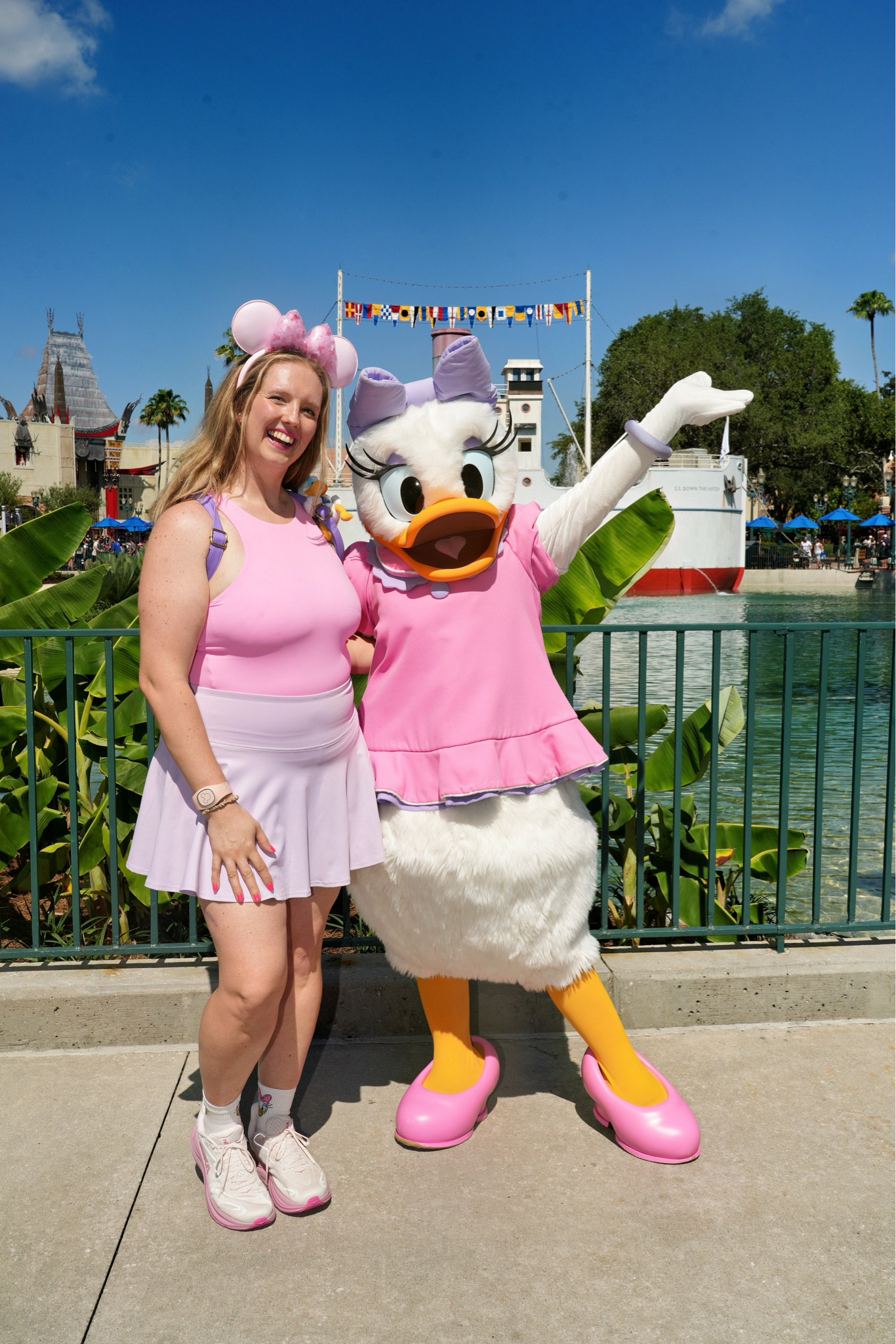 Daisy Duck Disney bounding outfit. All athleisure and all comfortable! Found these ears currently on sale and bought them on trip for the outfit. Will easily rewear this purple athletic skirt and pink athletic tank with built in bra again. My pink and purple HOKAs are also currently on sale!

#LTKootd #LTKTravel #LTKmomlife
