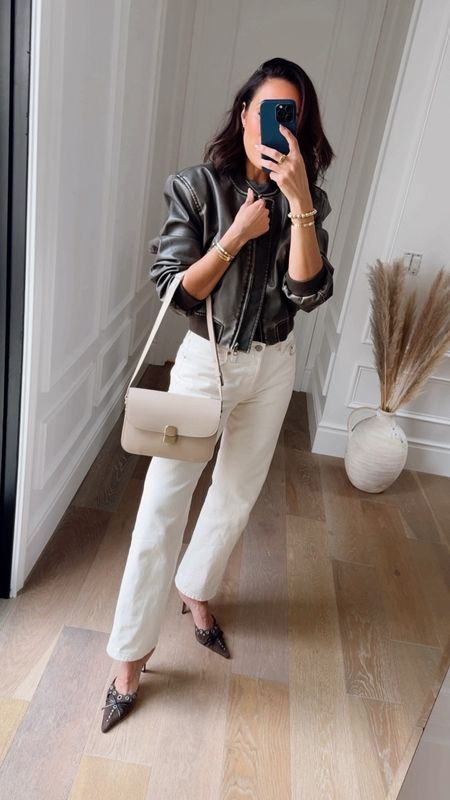 How I’m transitioning my cream Levi’s from day to night 🍦 pulling on this cooler then cool bomber jacket that just instantly makes outfits better, brown mules and my new favorite bag for winter! The Sand color goes perfect with neutrals, black and trending browns! 

Size up in jeans for similar fit (26)

#LTKover40 #LTKfindsunder100 #LTKVideo