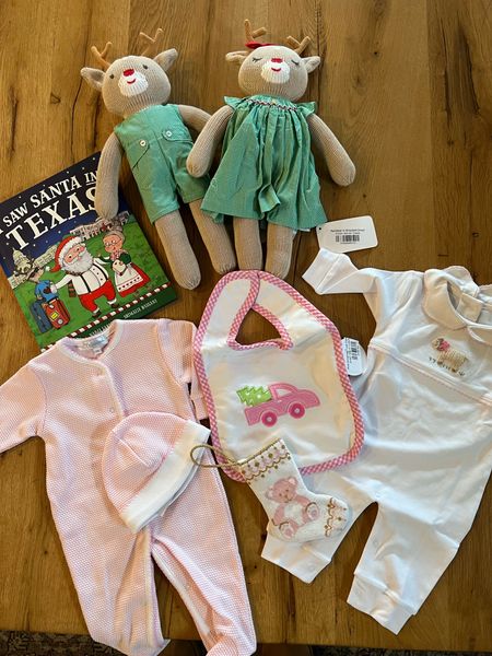 Christmas themed books, plushes and clothes for newborns 