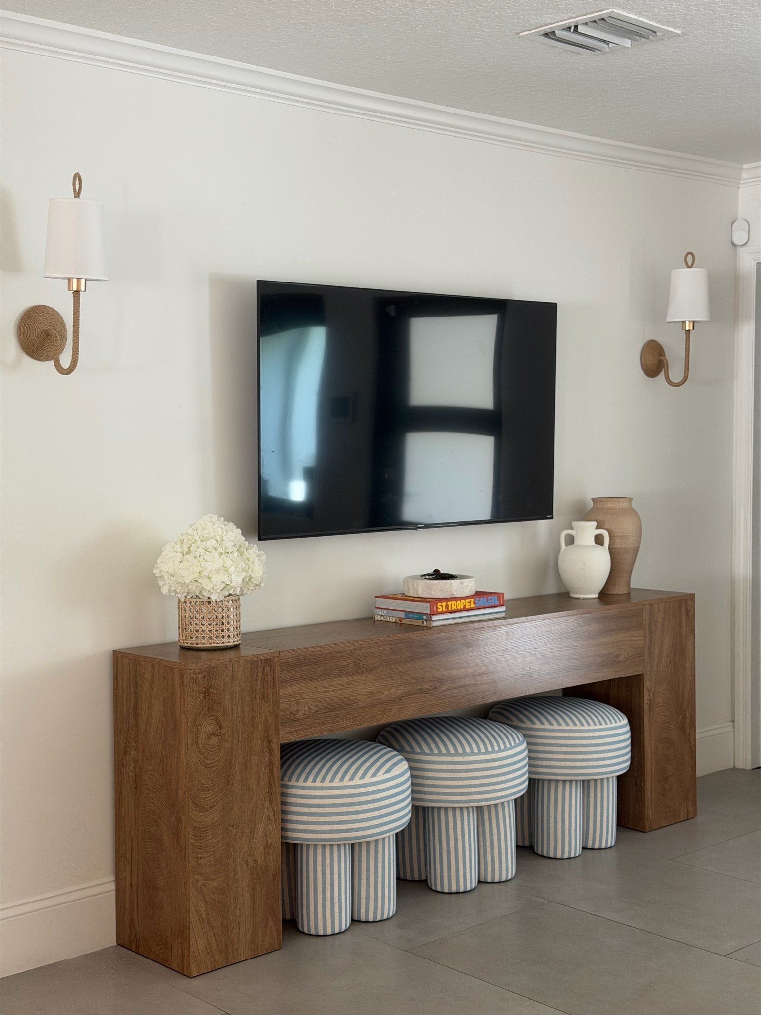 entry way console, accent ottomans and wireless sconces!

#LTKHome