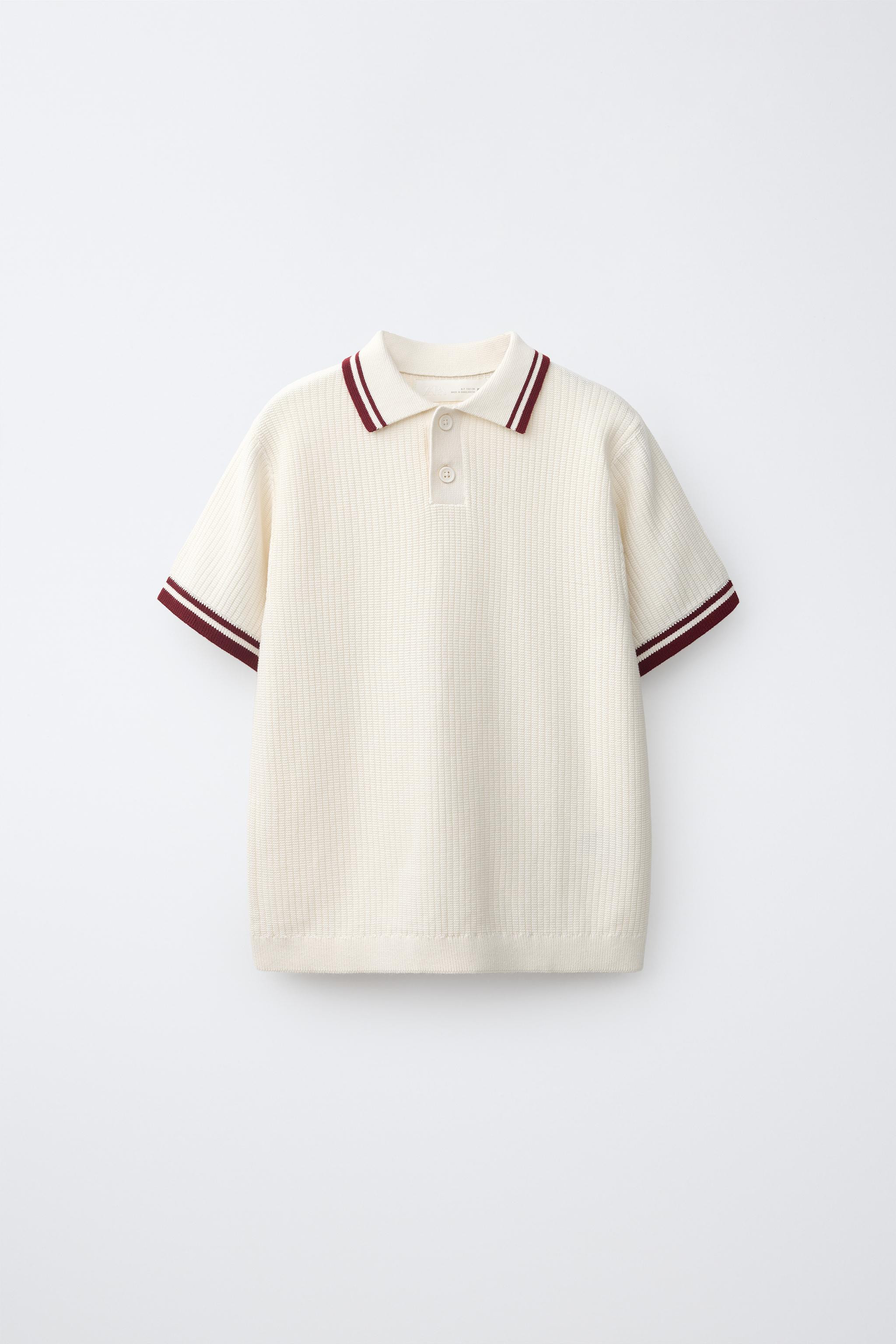 Ribbed knit polo shirt with polo collar and short sleeves. Button closure at the yoke with contra... | Zara US