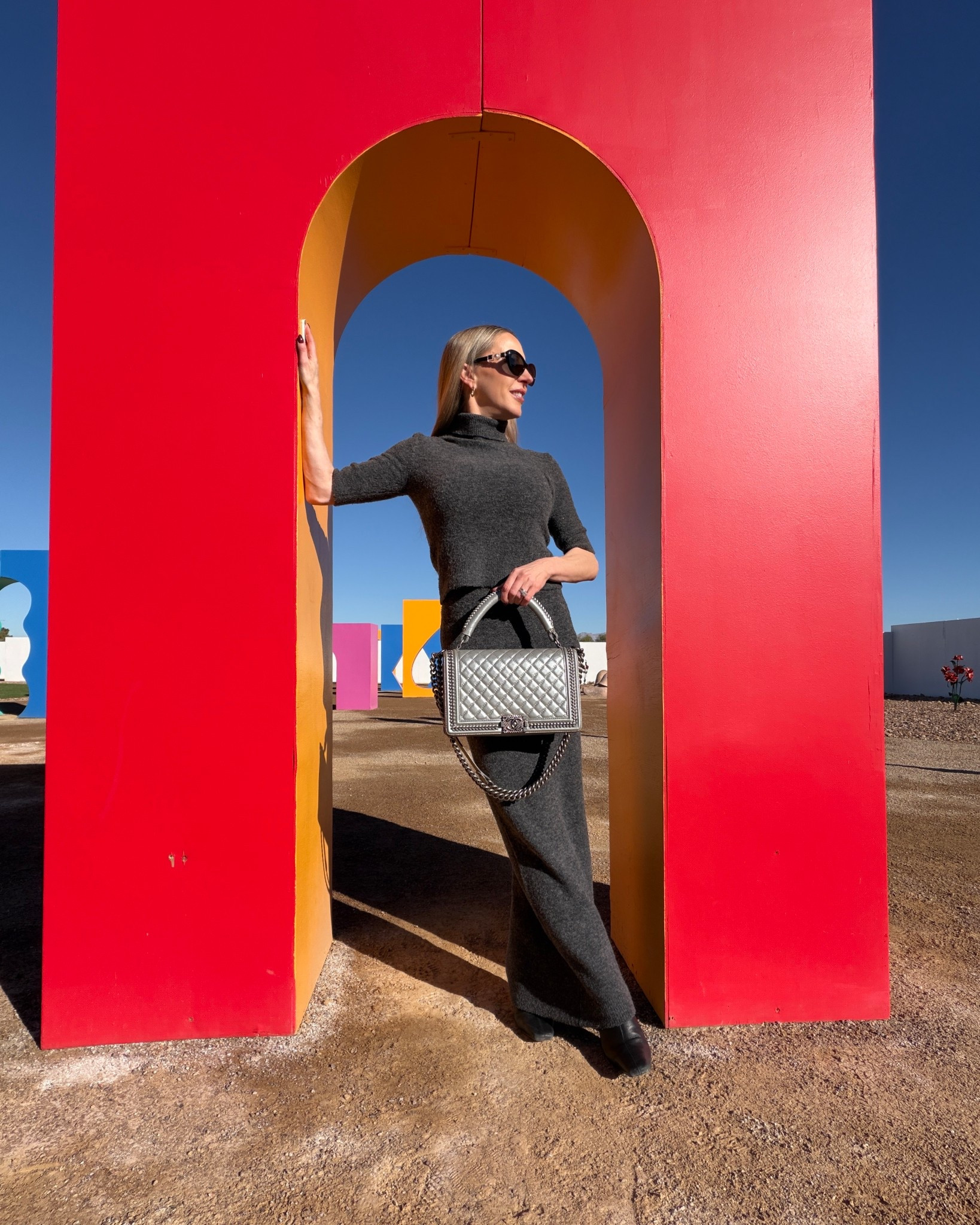 Chanel bag outfit ❤️ Casual chic Winter outfit idea or Spring outfit idea. #ad Revolve grey matching knit maxi skirt & fitted roll neck sweater / turtleneck sweater set. Styled with black leather knee high boots and Silver Chanel Boy Bag 🖤 

#LTKWorkwear #LTKgrwm #LTKootd