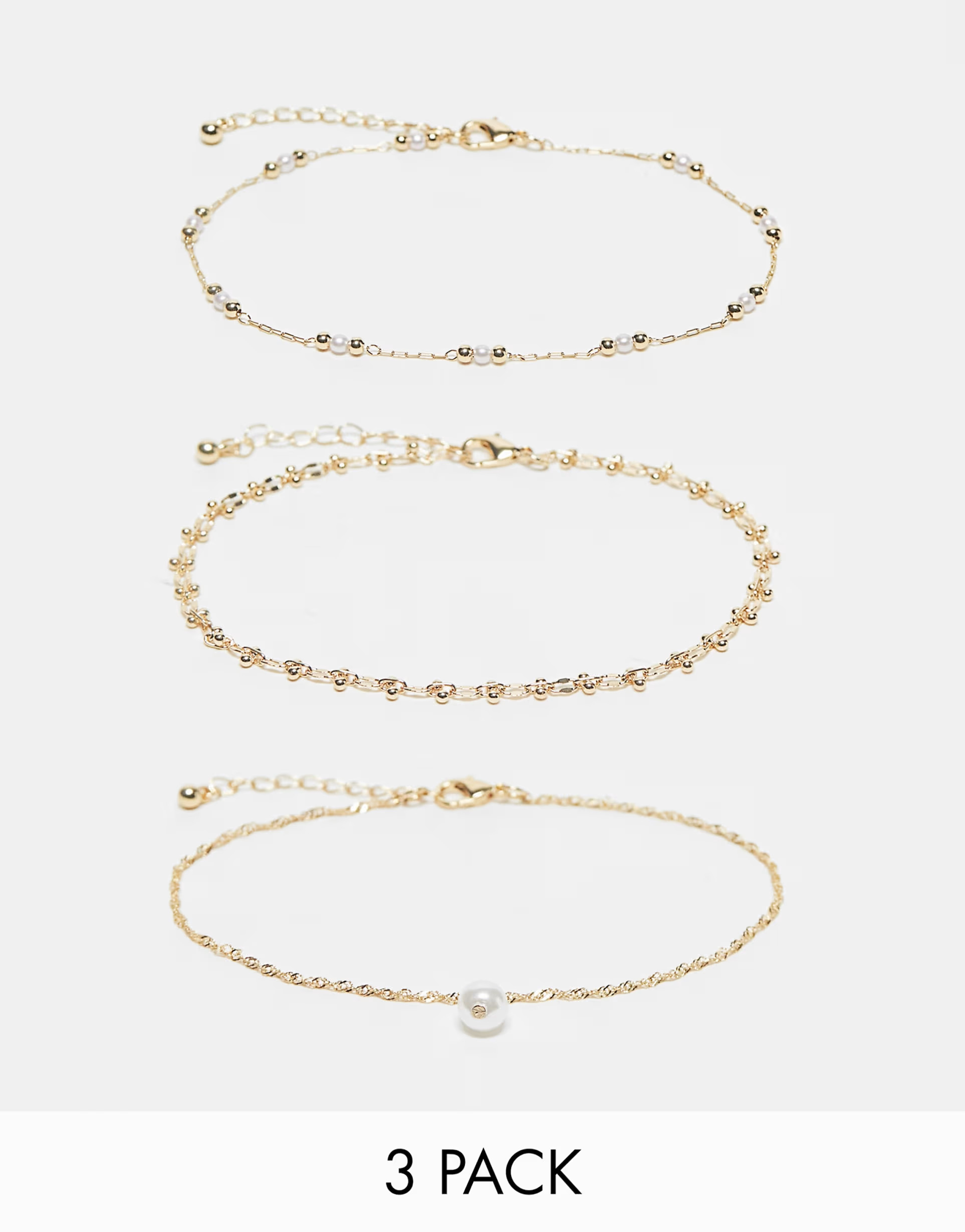 ASOS DESIGN Curve pack of 3 anklets with faux pearl and ball design in gold tone | ASOS | ASOS (Global)