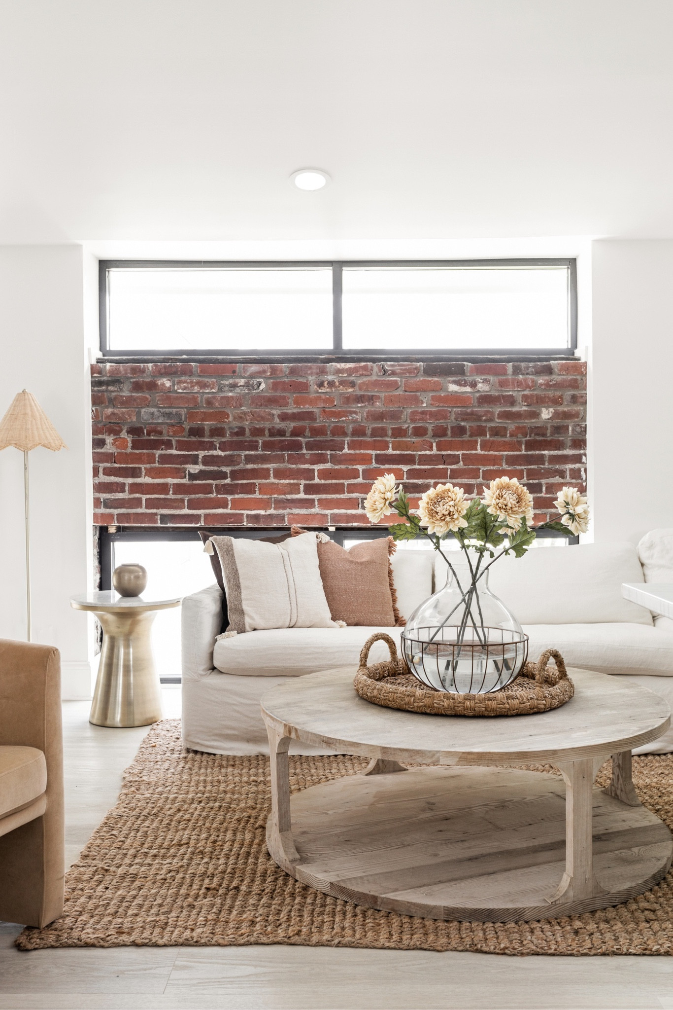 The Scandinavian minimalist aesthetic is brought out through the light, neutral tones and minimal decor in the living space.

#LTKhome