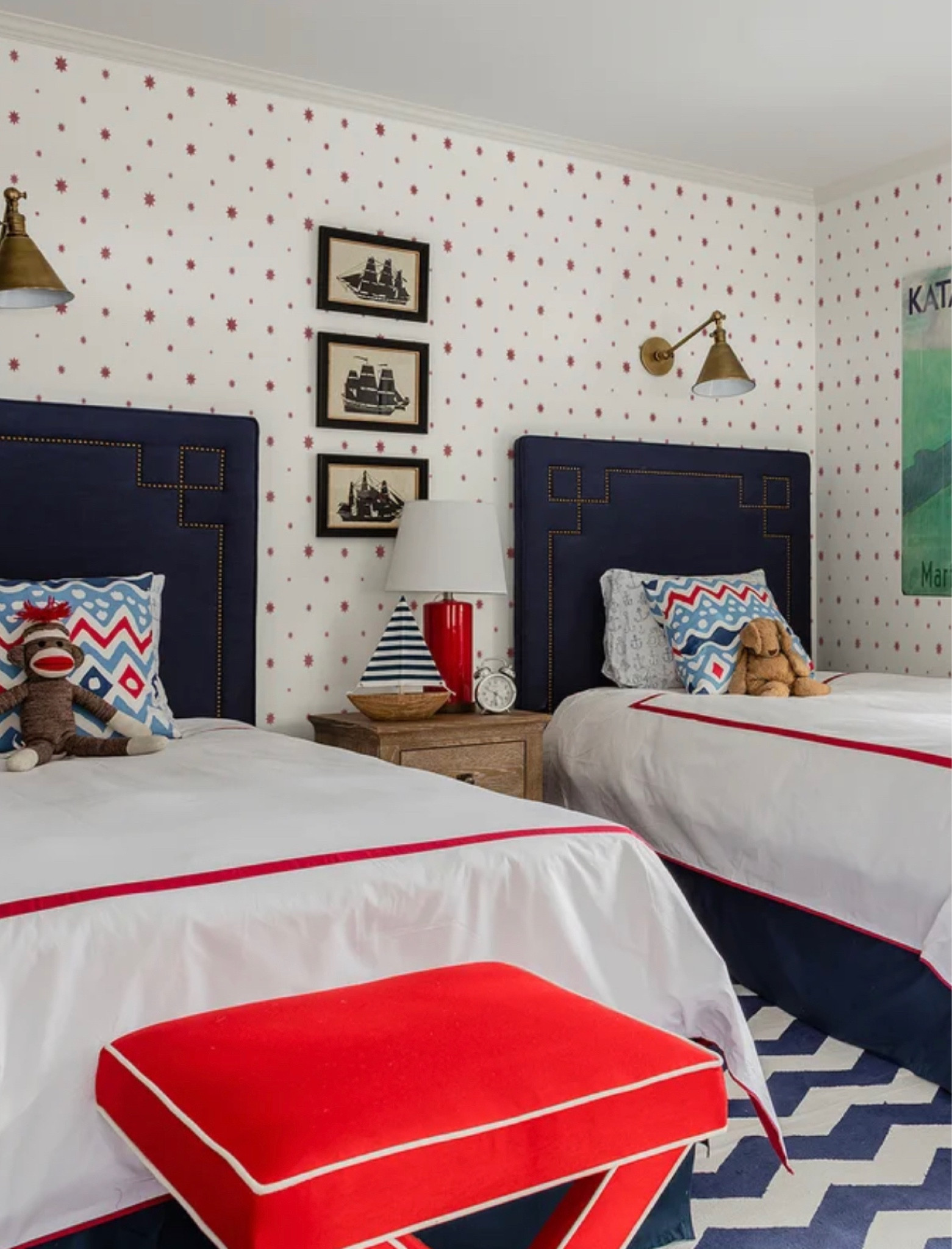 Grandmillennial red blue star wallpaper boy room reading light brass hood sconce 