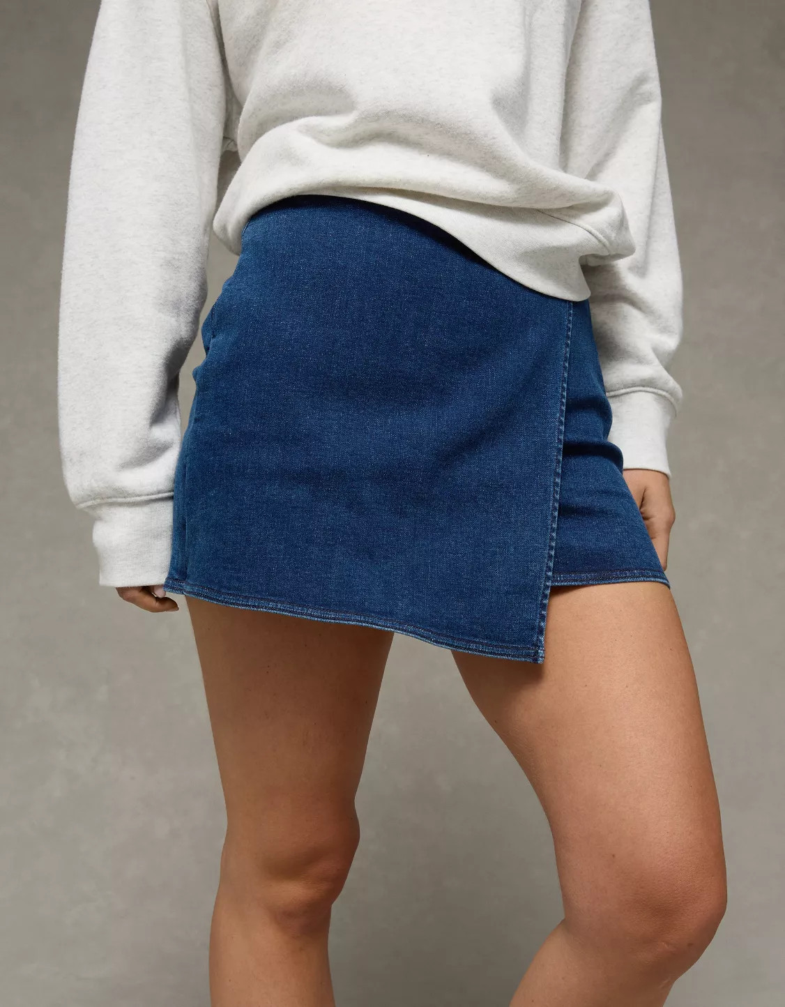 AE Next Level High-Waisted Denim Mini Wrap Skort | American Eagle Outfitters (US & CA)