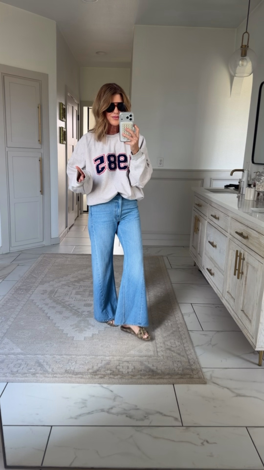 Wearing a size 27 in the lemon twist jeans and a medium sweatshirt 

#LTKOver40 #LTKSpringSale