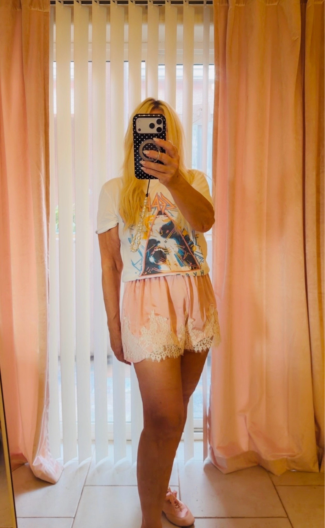 A graphic tee, pink satin shorts, and matching sneakerinas create an effortless outfit that’s comfortable, feminine, and perfect for everyday style.

#LTKootd #LTKPetite #LTKOver40