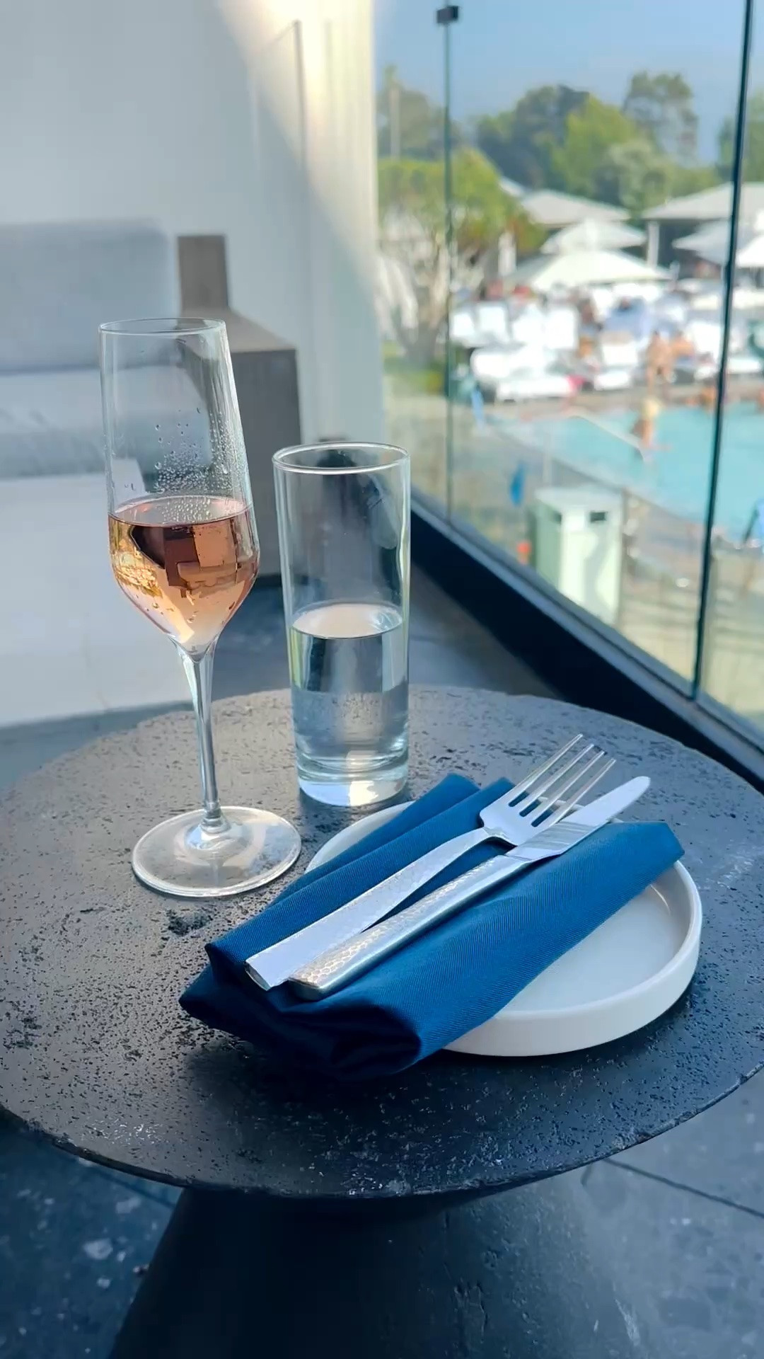 Lounging by the pool with a chilled glass of rosé and a beautiful view—such an effortless way to slow down and enjoy a summer afternoon. A simple place setting with elegant drinkware, modern dinnerware, and a crisp blue napkin makes even a casual poolside moment feel polished and special.

#Poolside #PoolsideLounge #WineGlasses #ChampagneFlute #Drinkware #Dinnerware #DinnerPlate #Tableware #Napkin #TableLinen #EntertainingEssentials #SummerEntertaining #OutdoorLiving

#LTKdayinmylife #LTKvlog #LTKHome