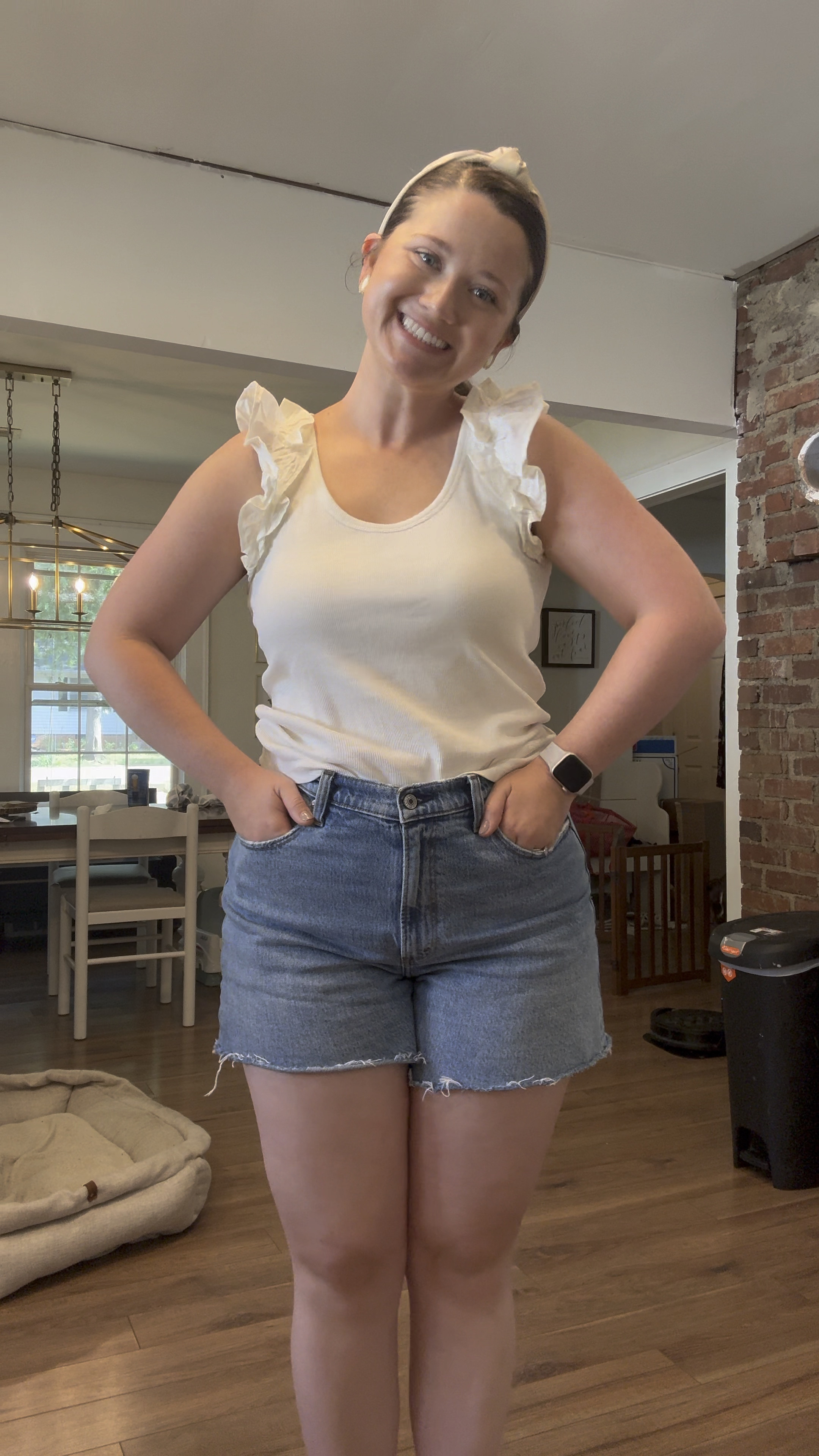 Summer mom ootd. White ruffle tank top. Denim shorts I love 