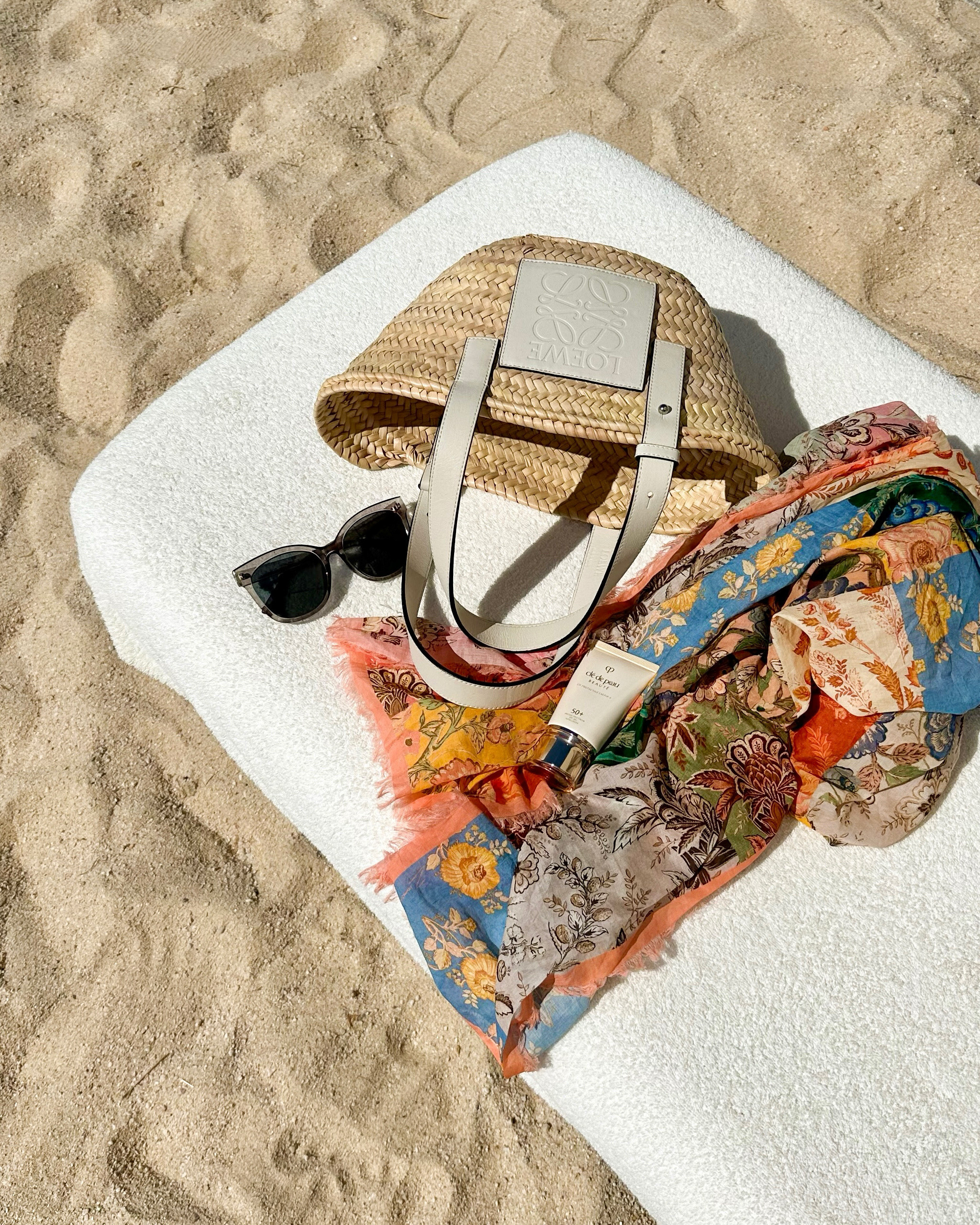 Loewe straw tote, summer bag, Zimmermann sarong pareo. 

#LTKSummerEdit #LTKItBag #LTKTravel