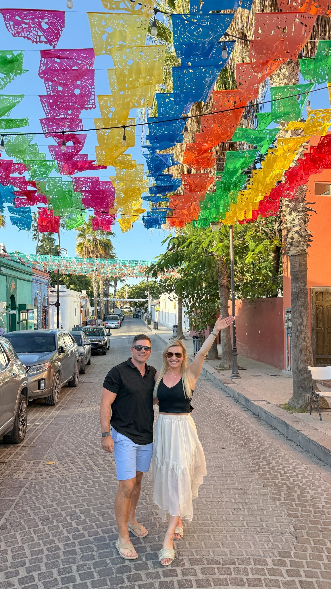 What to wear to Cabo’s Thursday Night Art Walk 🇲🇽✨

San José del Cabo’s Gallery District comes alive every Thursday night — colorful papel picado overhead, cobblestone streets, live music, art galleries, and dinner reservations after.

For this night out, I wore an easy black crop tank with a flowy neutral midi skirt & comfy slide sandals — polished but breathable for warm Cabo evenings.

My husband kept it classic with a black polo, tailored light blue shorts & neutral sandals — perfect for a casual but elevated vacation look.

Saving this for your Cabo trip!

⸻

Cabo outfit ideas, Cabo vacation outfits, what to wear in Cabo, Cabo art walk outfit, San Jose del Cabo outfit, Mexico vacation outfits, resort wear women, neutral vacation outfit, black crop tank outfit, midi skirt summer outfit, flowy skirt vacation outfit, summer night outfit warm weather, vacation date night outfit, cobblestone street outfit, chic travel outfit, travel couple outfits, men’s resort wear outfit, men’s summer vacation outfit, polo and shorts outfit men, light blue shorts outfit men, casual luxury vacation outfit, Cabo travel style, Thursday night art walk Cabo, San Jose del Cabo gallery district outfit, Mexico travel style inspiration

#LTKTravel #LTKMens