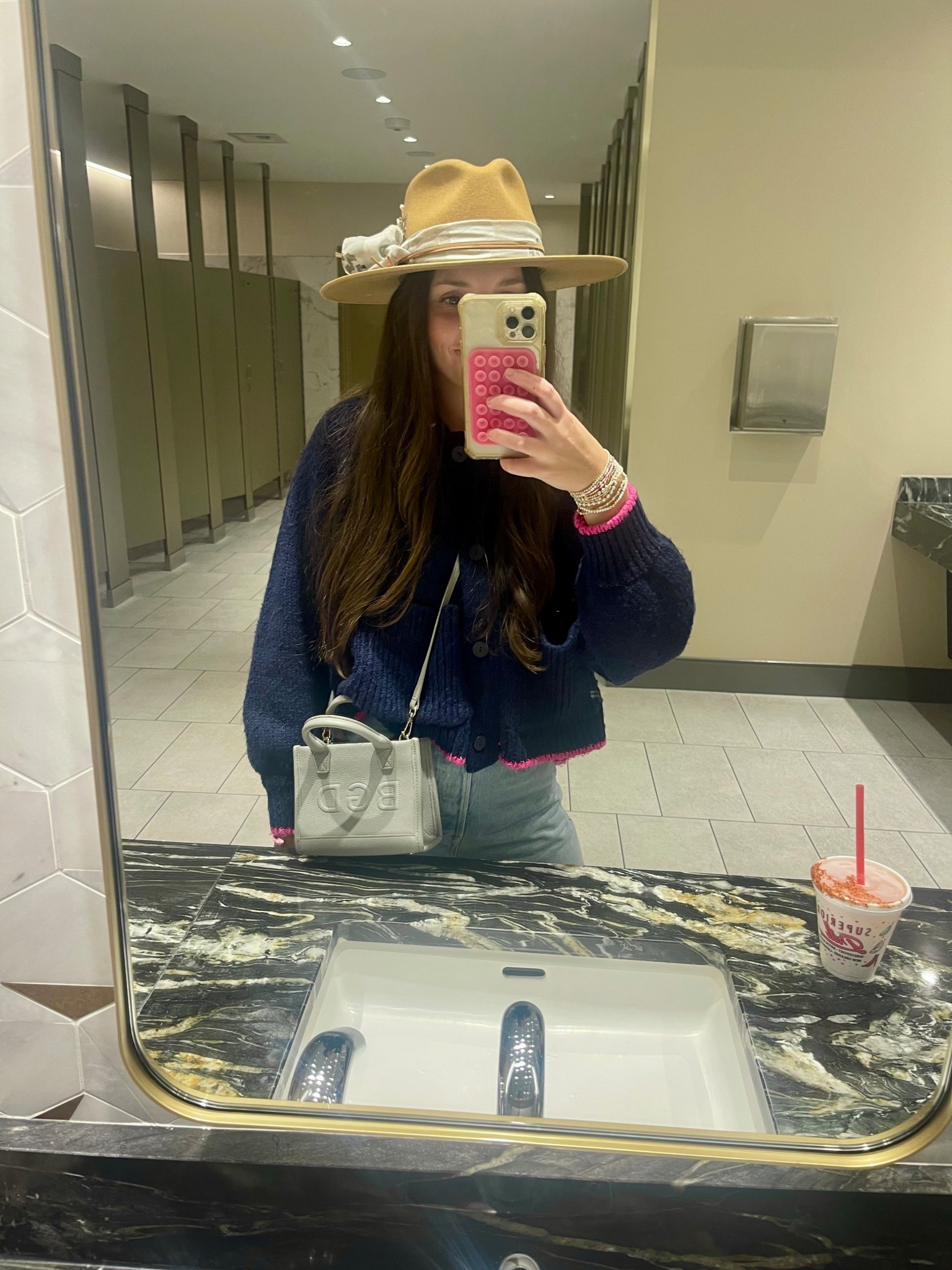 Anthropologie doodle cardigan 
leatherology micro bag 

#LTKootd #LTKmomlife #LTKHoliday