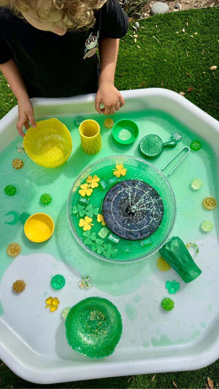 When your toddler asks for water play… 
you say YES 🍀💧

A little cornstarch, green water, and imagination turned into the best hands-on activity. This solar fountain might have helped too 😉
•
•
•
💚Resin bowls, scoop & vase @rumbleandresin 
💛Resin loose parts @roses_and_wellness 
☘️ 3D clovers & bowl @welchcreativewonders 

#sensoryplay #toddleractivities #learningthroughplay
#waterplay #homeschoolactivities